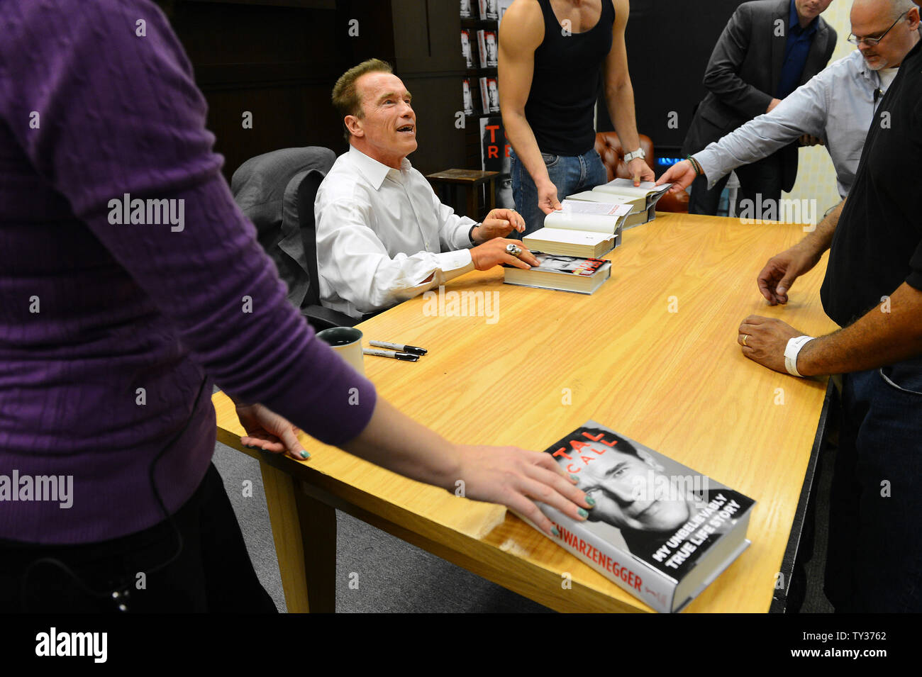 Arnold Schwarzenegger signs copies of his new book "Total Recall: My
