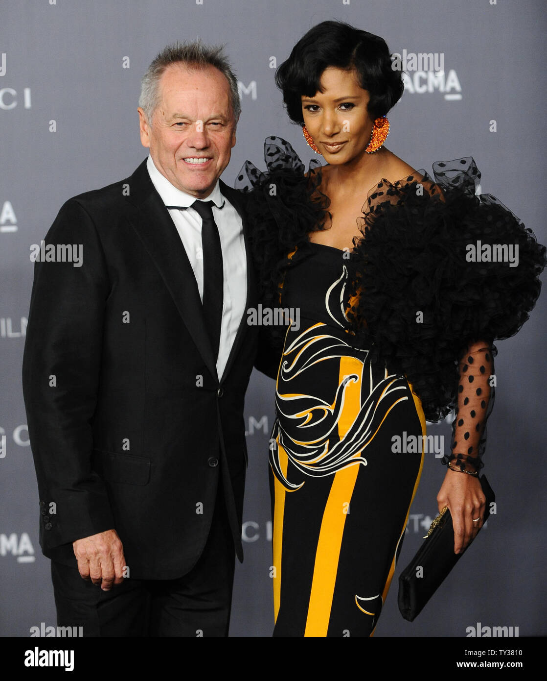 Chef Wolfgang Puck and designer Gelila Assefa arrive at the LACMA Art