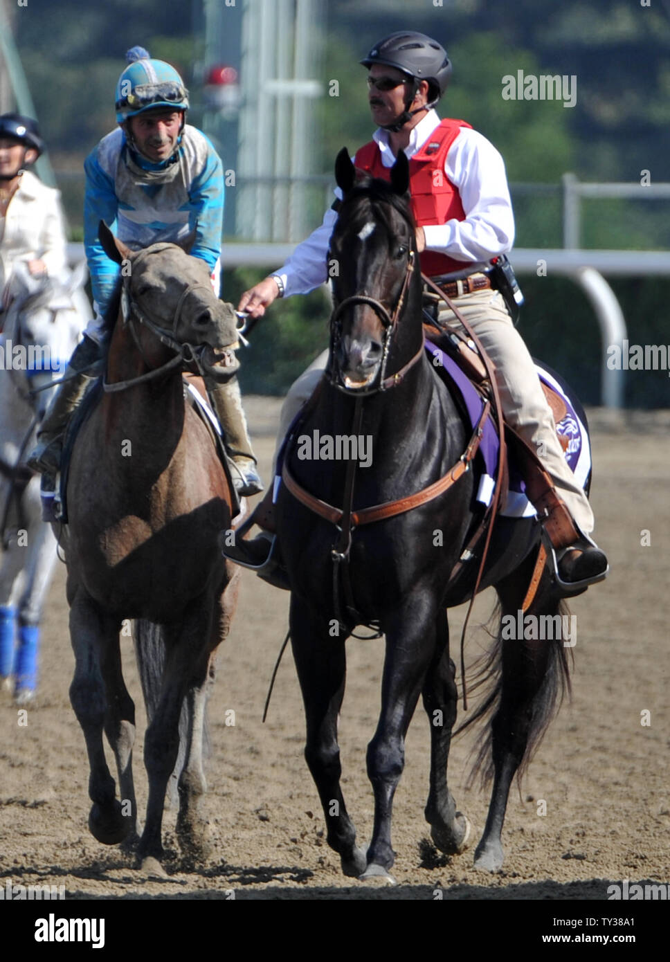 Aaron Gryder aboard Calidoscopio (L) heads to the winners circle after winning the Breeders Cup Marathon of the Breeders Cup World Championships at Santa Anita Park in Arcadia, CA November 2, 2012. UPI/Art Foxall Stock Photo
