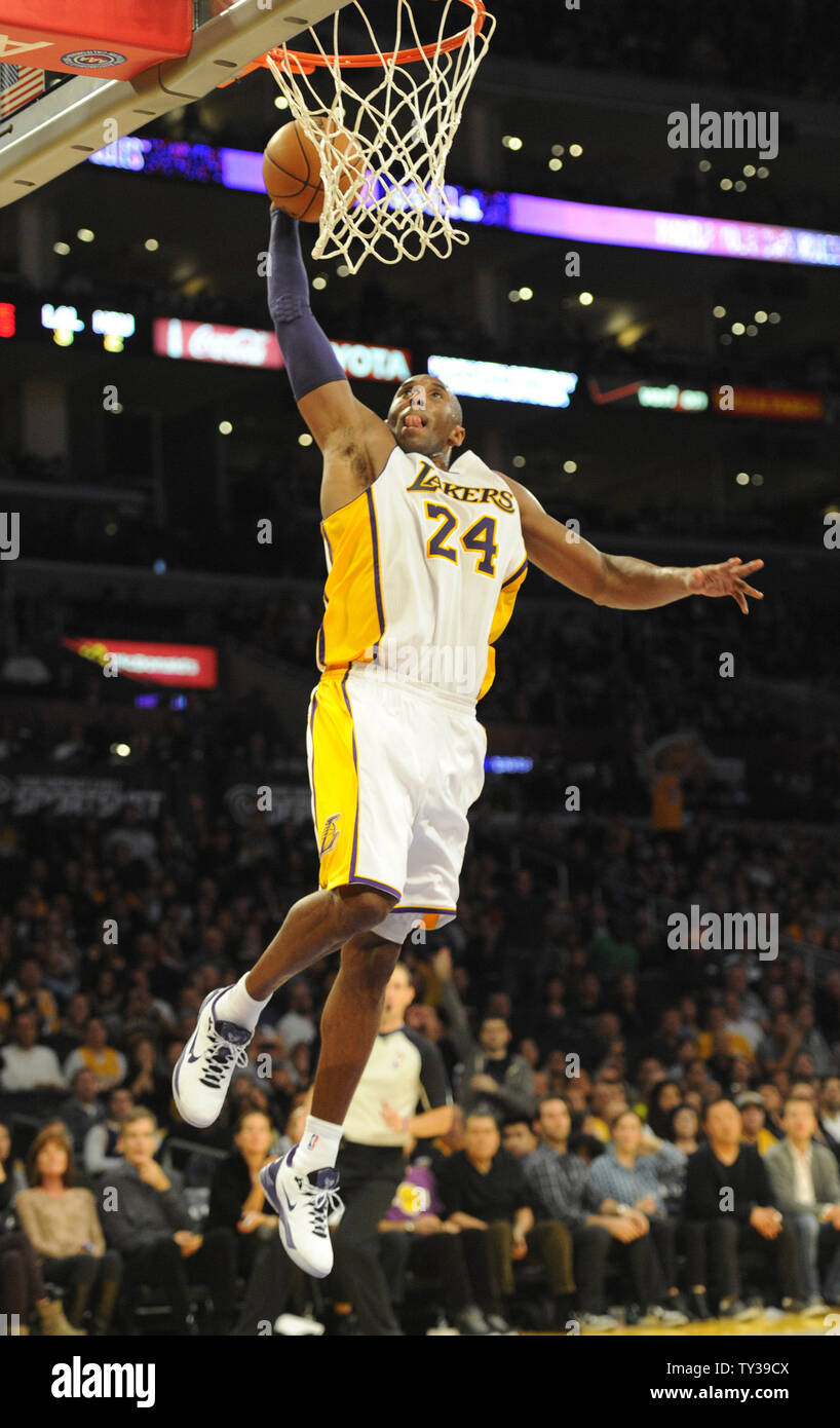 Los Angeles Lakers shooting guard Kobe Bryant (24) goes up for a dunk in the second half of an NBA basketball game against the Houston Rockets in Los Angeles on November 18, 2012.  The Lakers won 119 to 108.  UPI/Lori Shepler Stock Photo