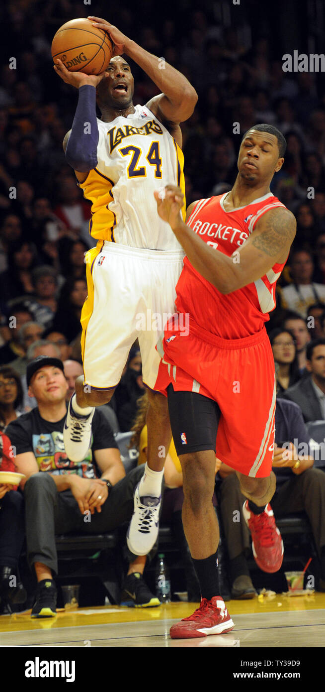 Los Angeles Lakers shooting guard Kobe Bryant (24) is fouled by Houston Rockets power forward Terrence Jones, right, and makes the shot in the second half of an NBA basketball game in Los Angeles on November 18, 2012.  The Lakers won 119 to 108.  UPI/Lori Shepler Stock Photo