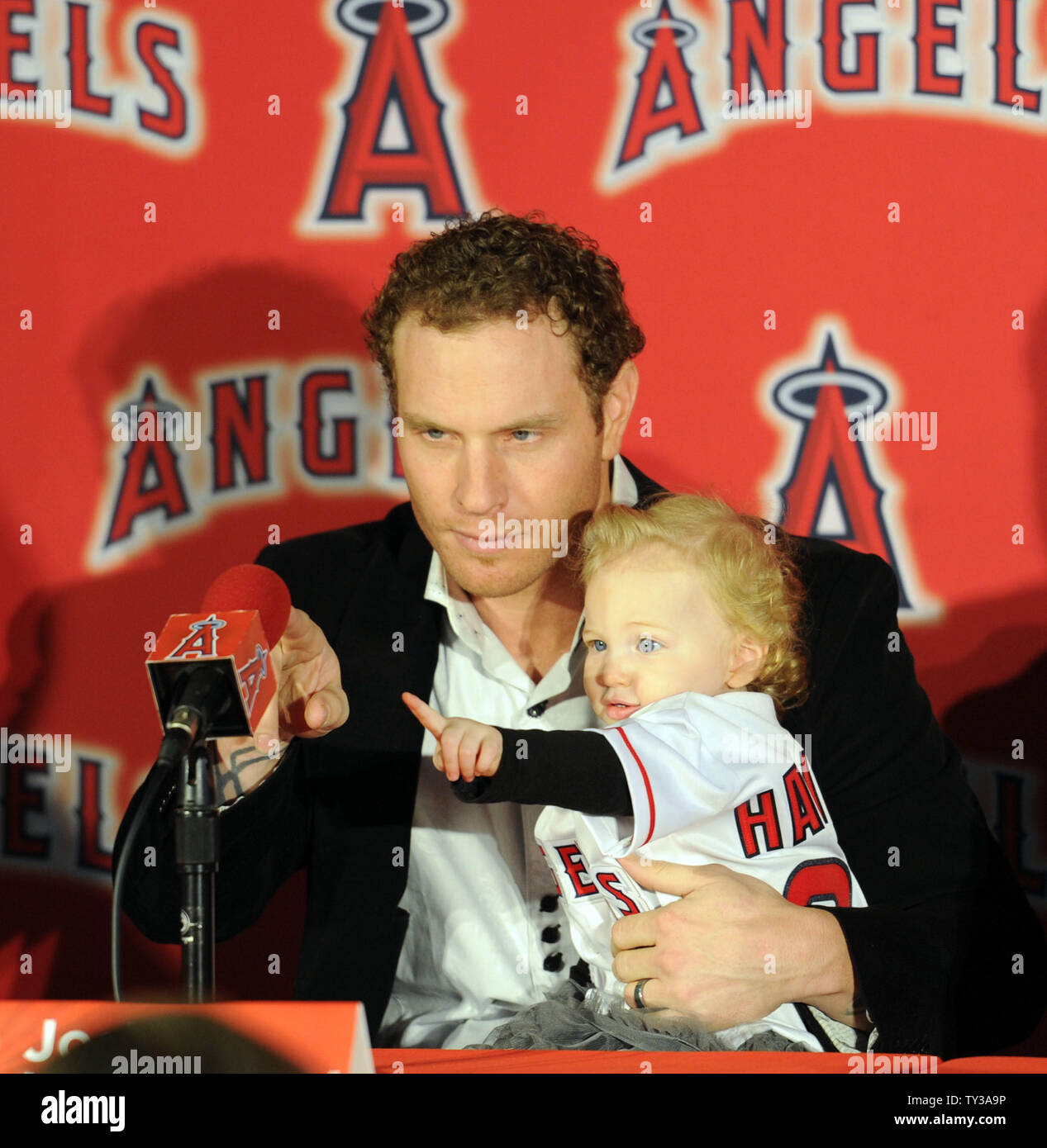 The Los Angeles Angels introduce outfielder, Josh Hamilton in a press  conference as his 15 month old daughter, Stella, sits in his lap at ESPN  Zone at Downtown Disney in Anaheim, California