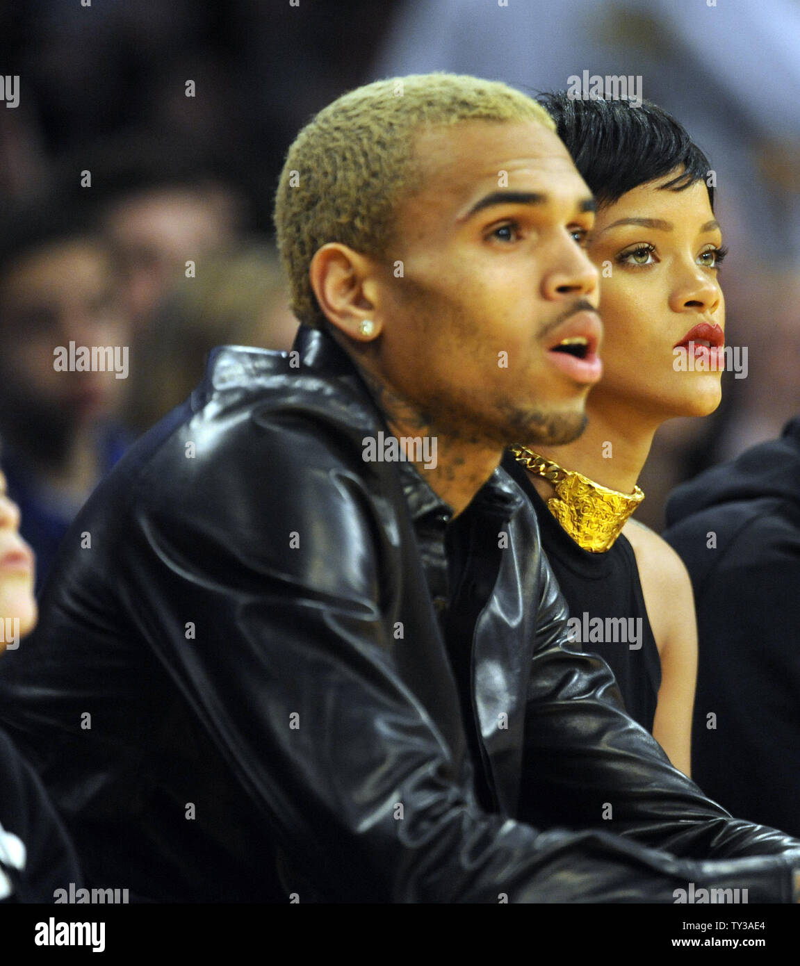 Rihanna, Chris Brown laughing together at LA Lakers NBA game, December 2012  Stock Photo - Alamy