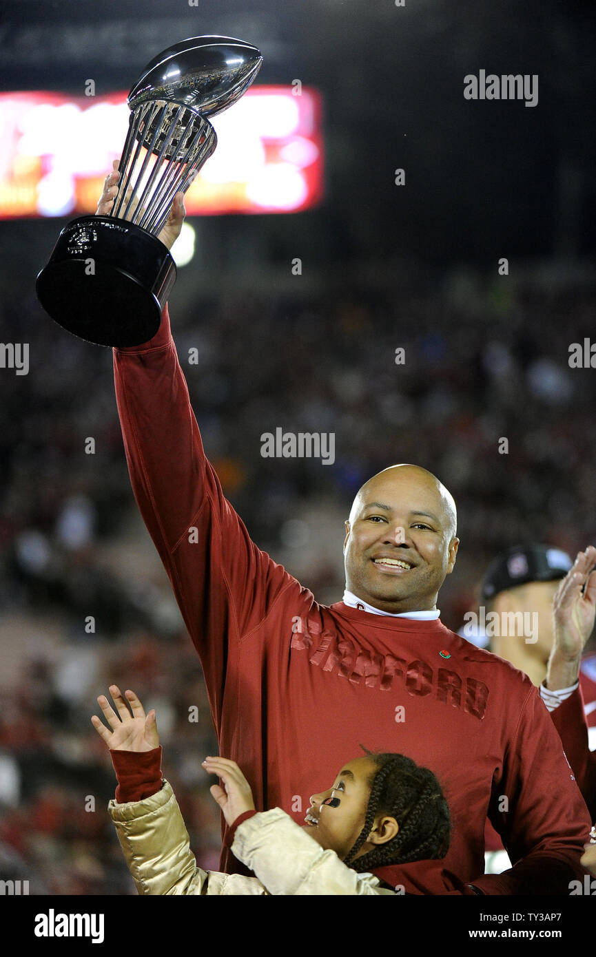 Stanford Cardinal head coach David Shaw lifts up the 2013 Rose Bowl Trophy after his team's victory over the Wisconsin Badgers 20-14 at the Rose Bowl in Pasadena, California on January 1, 2013.  UPI/Jon SooHoo Stock Photo