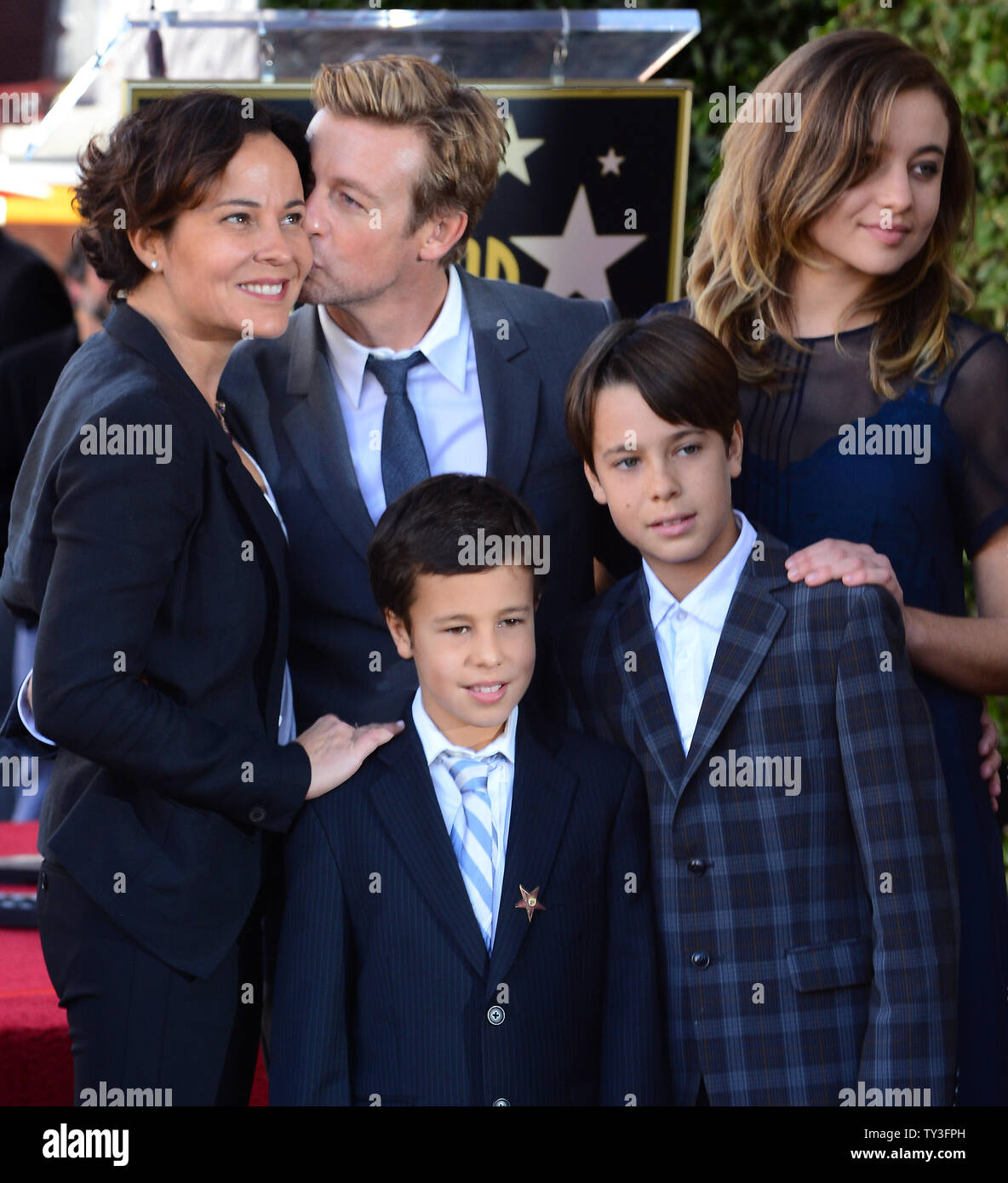 Australian actor Simon Baker (C) poses with his wife Rebecca Rigg and their sons Claude Blue and Harry Friday and daughter Stella Breeze (L-R) during an unveiling ceremony, honoring him with the 2,490th star on the Hollywood Walk of Fame in Los Angeles on February 14, 2013. UPI/Jim Ruymen Stock Photo