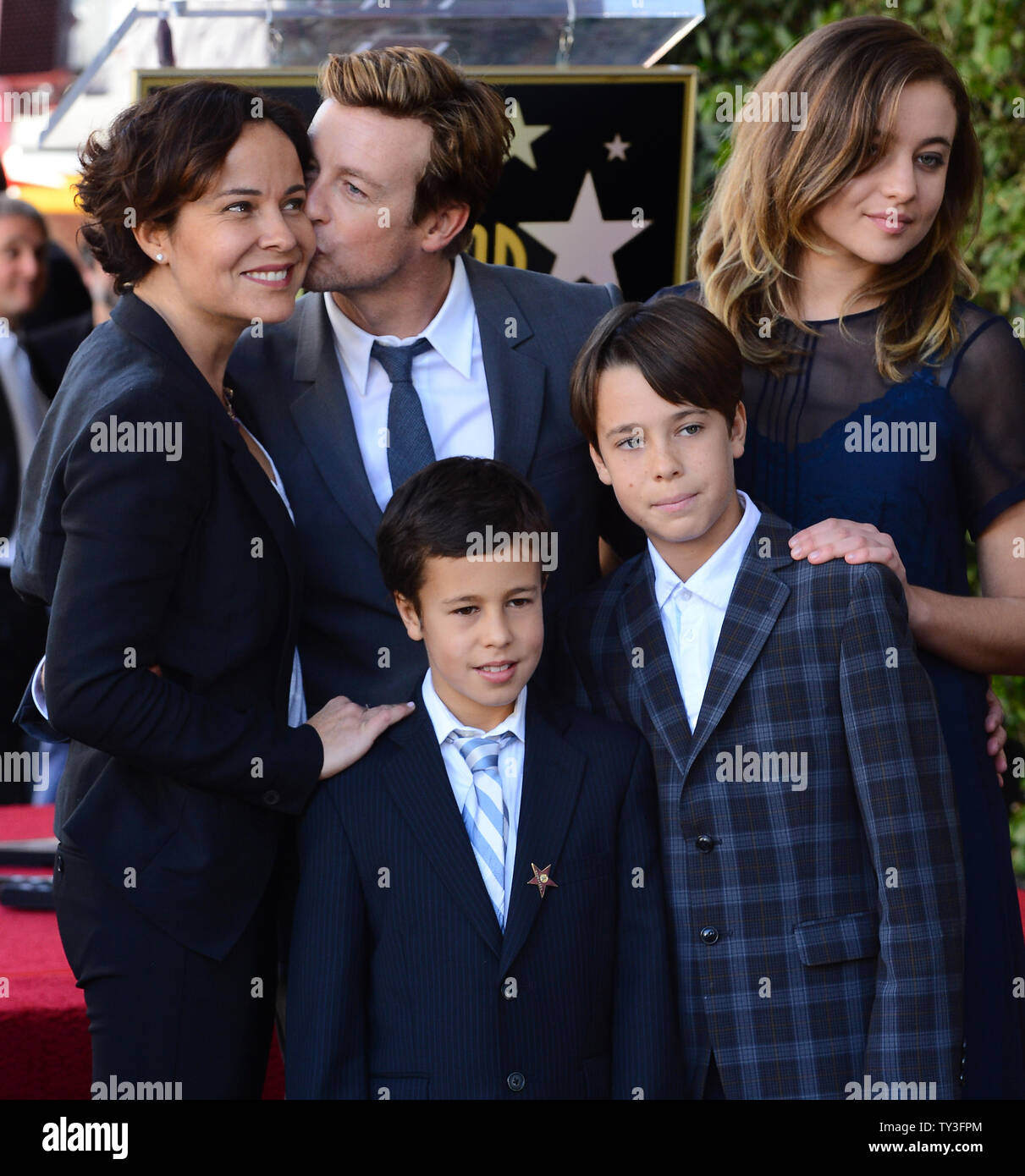 Australian actor Simon Baker (C) poses with his wife Rebecca Rigg and their sons Claude Blue and Harry Friday and daughter Stella Breeze (L-R) during an unveiling ceremony, honoring him with the 2,490th star on the Hollywood Walk of Fame in Los Angeles on February 14, 2013. UPI/Jim Ruymen Stock Photo