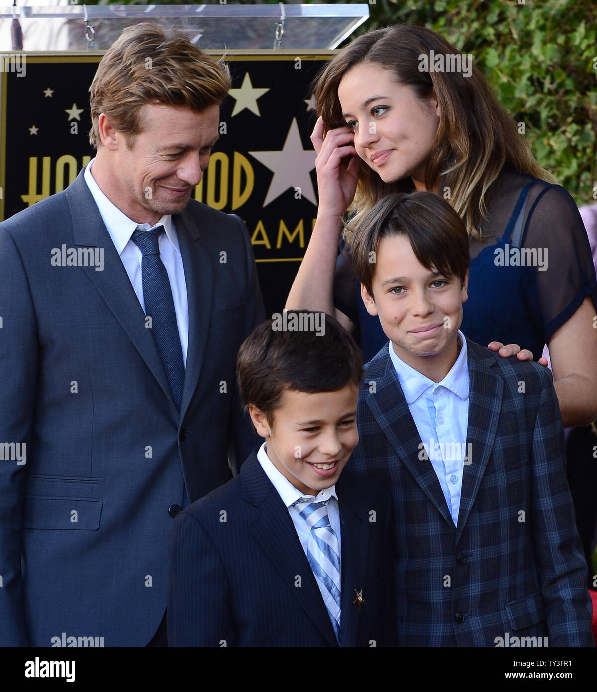 Australian actor Simon Baker is joined by his sons Claude Blue and Harry Friday and daughter Stella Breeze (L-R) during an unveiling ceremony, honoring him with the 2,490th star on the Hollywood Walk of Fame in Los Angeles on February 14, 2013. UPI/Jim Ruymen Stock Photo