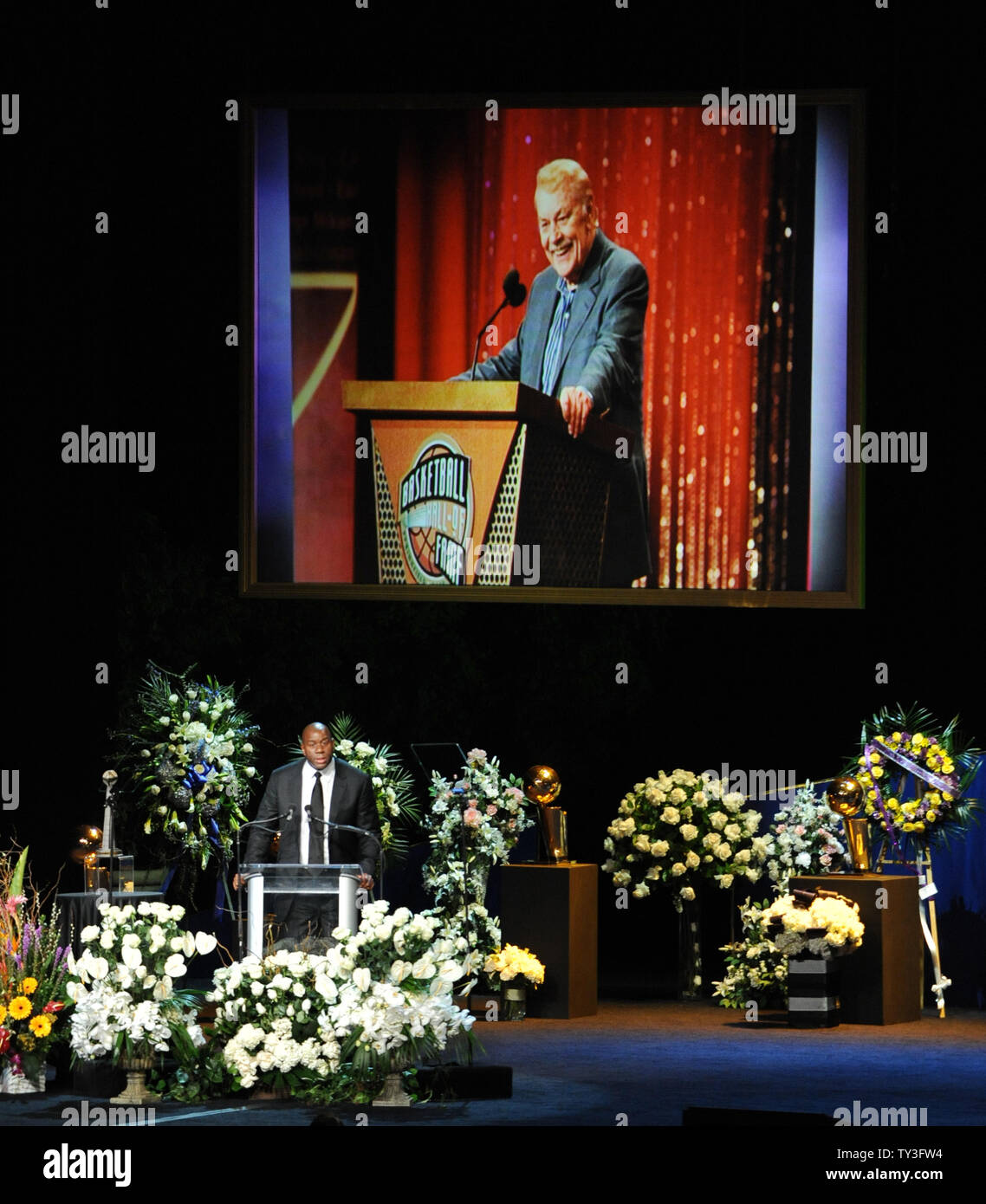 Earvin 'Magic' Johnson speaks during a memorial service for Los Angeles Lakers owner  in Los Angeles on February 21, 2013. Dr. Buss died at the age of 80 on Monday following an 18-month battle with cancer. Buss won 10 NBA championships as Lakers owner since purchasing the team in 1979.  UPI/Jim Ruymen Stock Photo