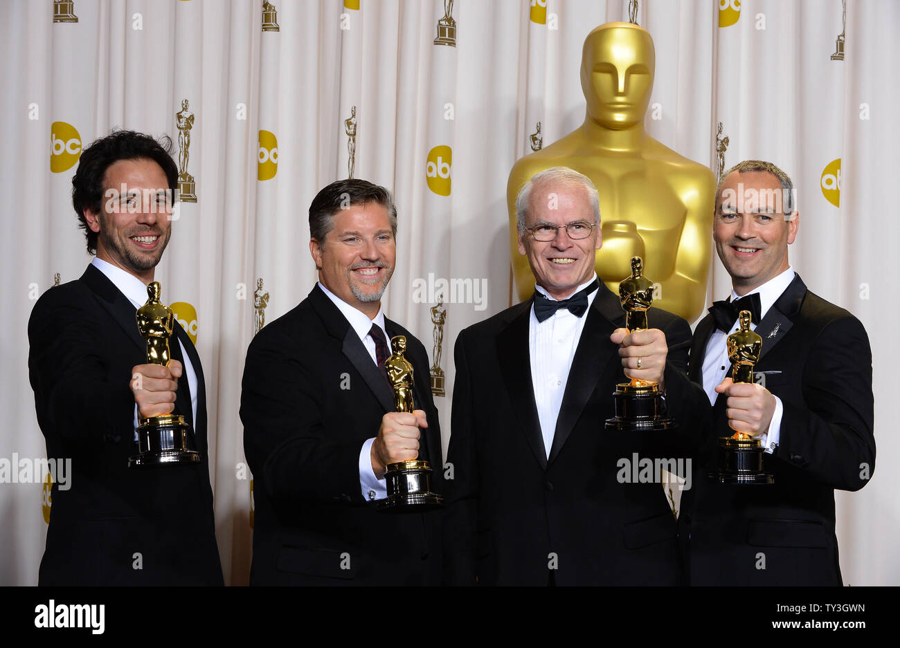 Bill Westenhofer, Guillaume Rocheron, Erik-Jan De Boer and Donald R. Elliot  hold their Oscars for best Achievement in Visual Effects - 'Life of Pi' backstage at the 85th Academy Awards at the Hollywood and Highlands Center in the Hollywood section of Los Angeles on February 24, 2013. UPI/Jim Ruymen Stock Photo