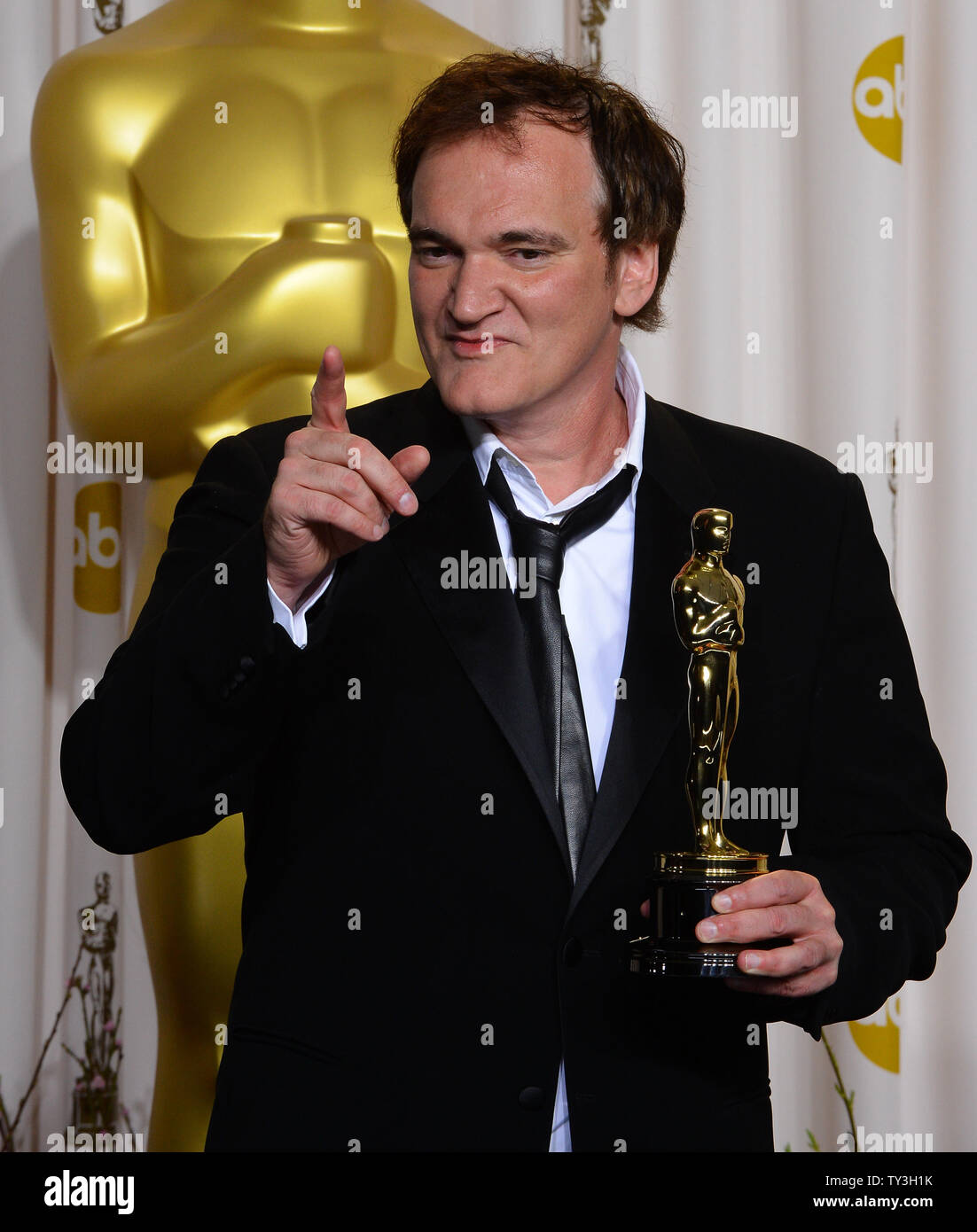 Writer and director Quentin Tarantino holds his Oscar for Original