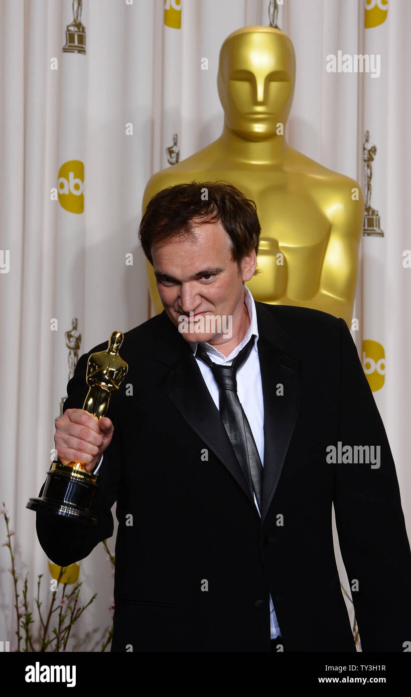 Writer and director Quentin Tarantino holds his Oscar for Original