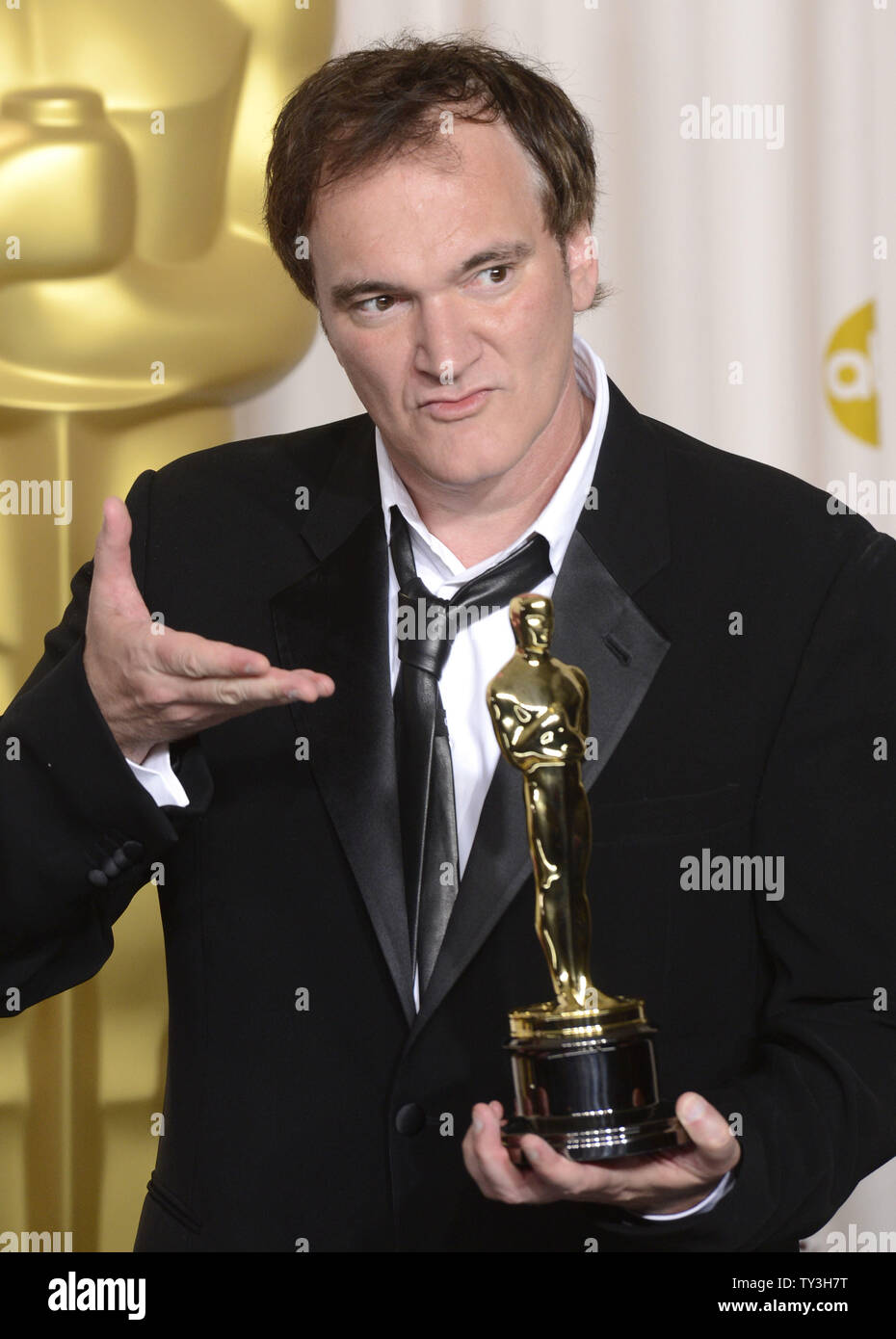 Quentin Tarantino poses with his Oscar for Original Screenplay for