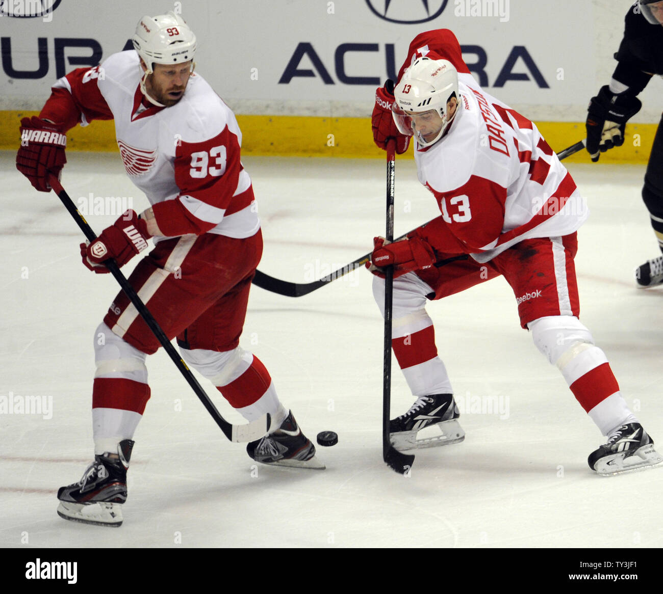 Detroit Red Wings left wing Johan Franzen (93) and Pavel Datsyuk (13) keep the puck away from the Anaheim Ducks in the first period at the Honda Center in Anaheim, California on March 24, 2013.  UPI/Lori Shepler. Stock Photo
