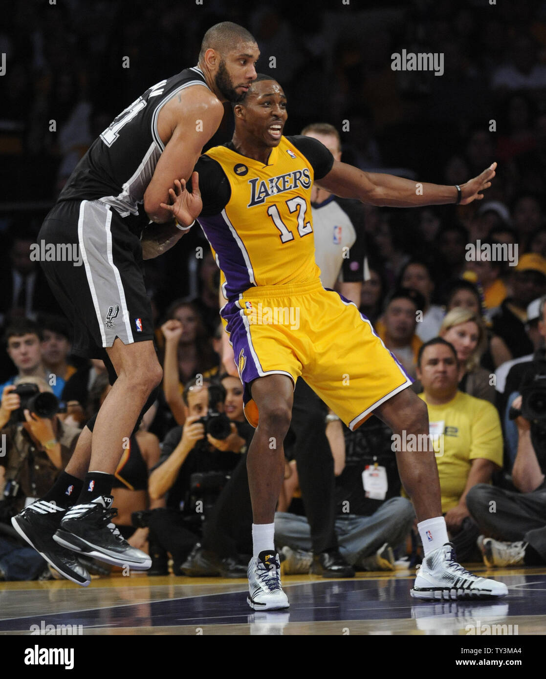 San Antonio Spurs power forward Tim Duncan (21) and Los Angeles Lakers center Dwight Howard (12) battle for position during the second half of game 3 of the Western Conference Playoffs at Staples Center in Los Angeles on April 26, 2013. The Spurs won 120 to 89. UPI /Lori Shepler Stock Photo
