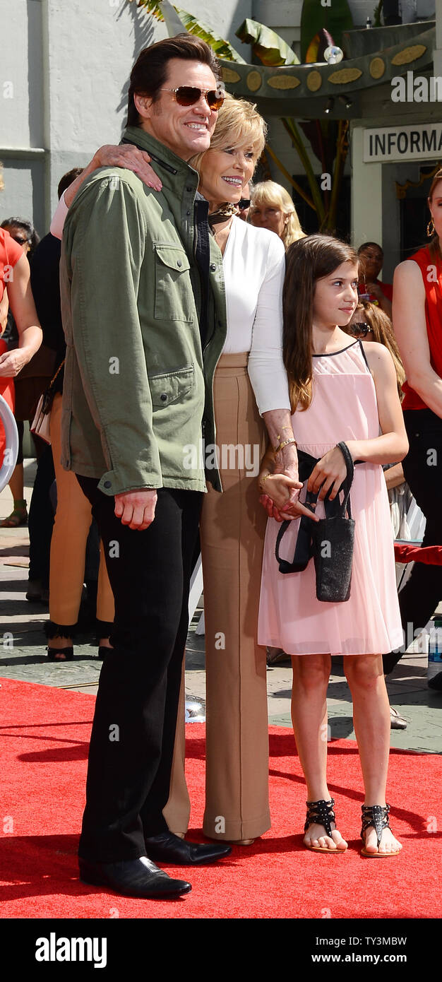 Actress Jane Fonda (C) poses with actor Jim Carrey (L), her stepdaughter Viva Vadim,  during a hand & footprint ceremony honoring her as part of the TCM Classic Film Festival, at TCL Chinese Theatre in the Hollywood section of Los Angeles on April 27, 2013. UPI/Jim Ruymen Stock Photo