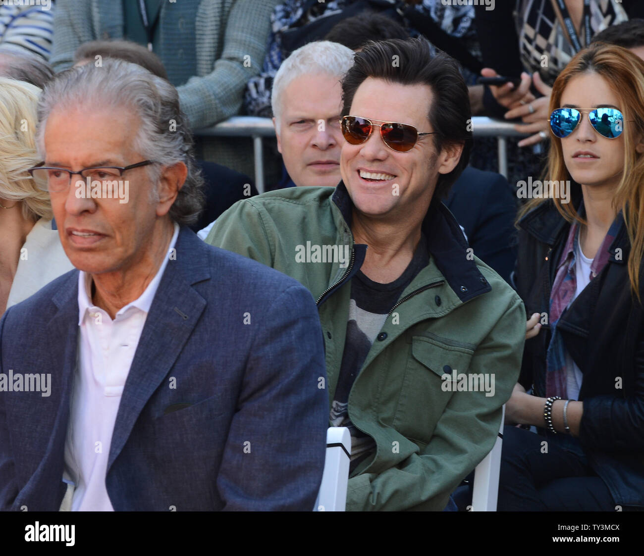 Actor Jim Carrey ¨ attend sa hand & footprint ceremony honoring actress Jane Fonda as part of the TCM Classic Film Festival, at TCL Chinese Theatre in the Hollywood section of Los Angeles on April 27, 2013. At left is Fonda's boyfriend, record producer Richard Perry. UPI/Jim Ruymen Stock Photo
