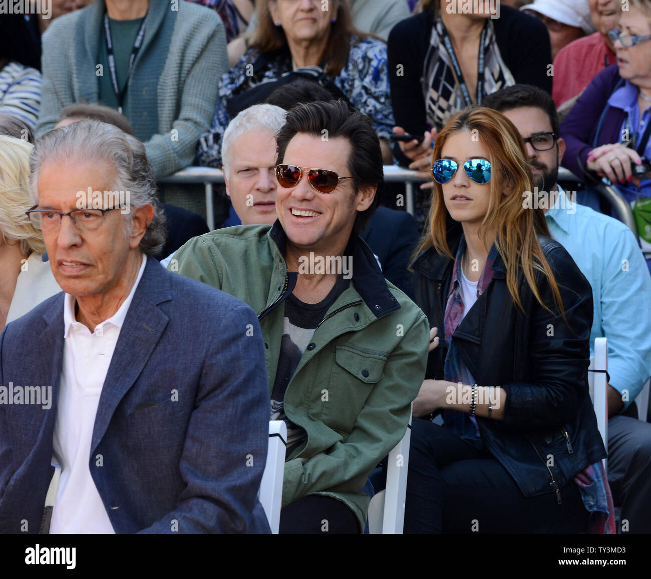 Actor Jim Carrey (R) attends a hand & footprint ceremony honoring actress Jane Fonda as part of the TCM Classic Film Festival, at TCL Chinese Theatre in the Hollywood section of Los Angeles on April 27, 2013. At left is Fonda's boyfriend, record producer Richard Perry. UPI/Jim Ruymen Stock Photo