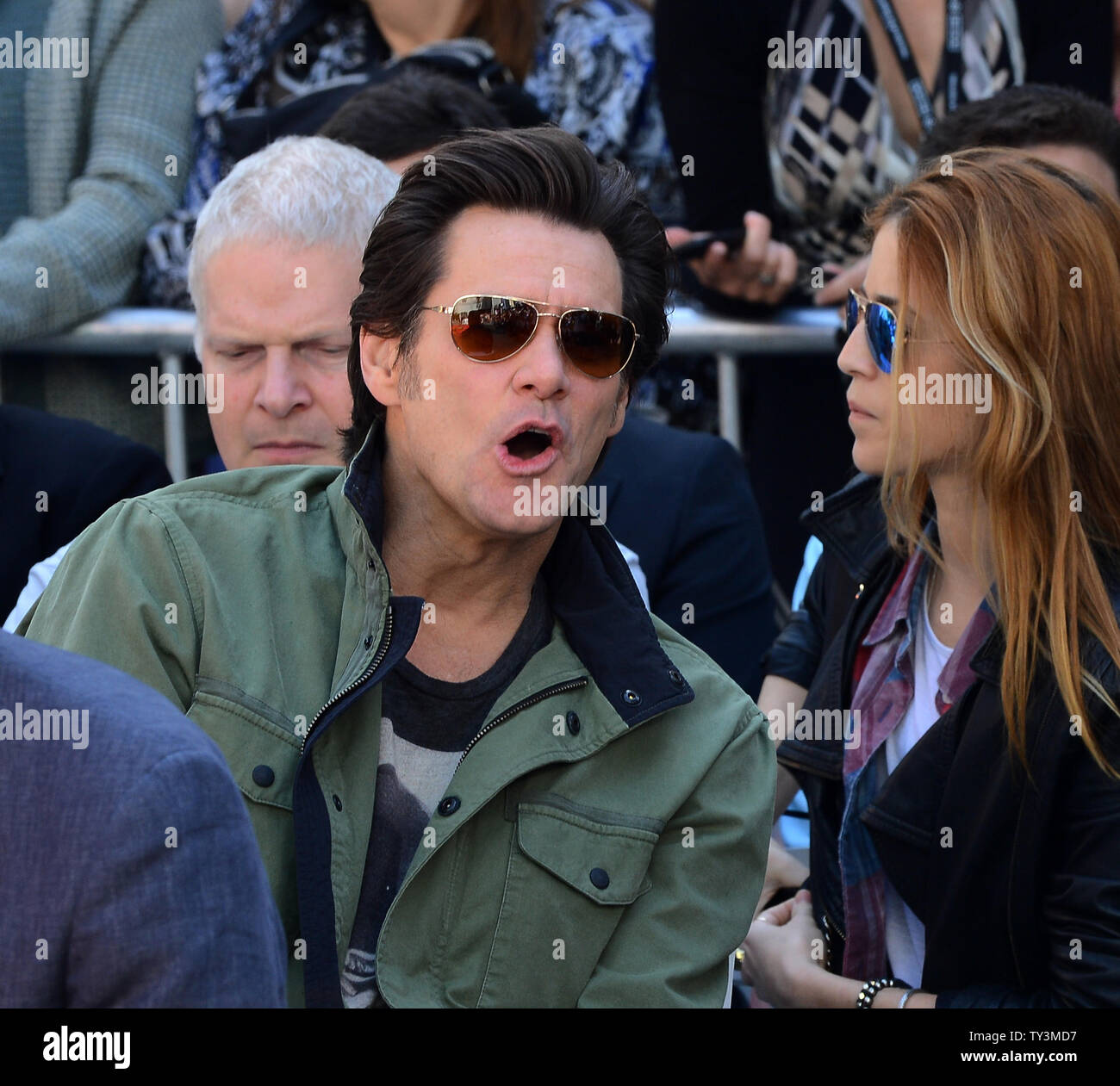 Actor Jim Carrey (R) attends a hand & footprint ceremony honoring actress Jane Fonda as part of the TCM Classic Film Festival, at TCL Chinese Theatre in the Hollywood section of Los Angeles on April 27, 2013. At left is Fonda's boyfriend, record producer Richard Perry. UPI/Jim Ruymen Stock Photo