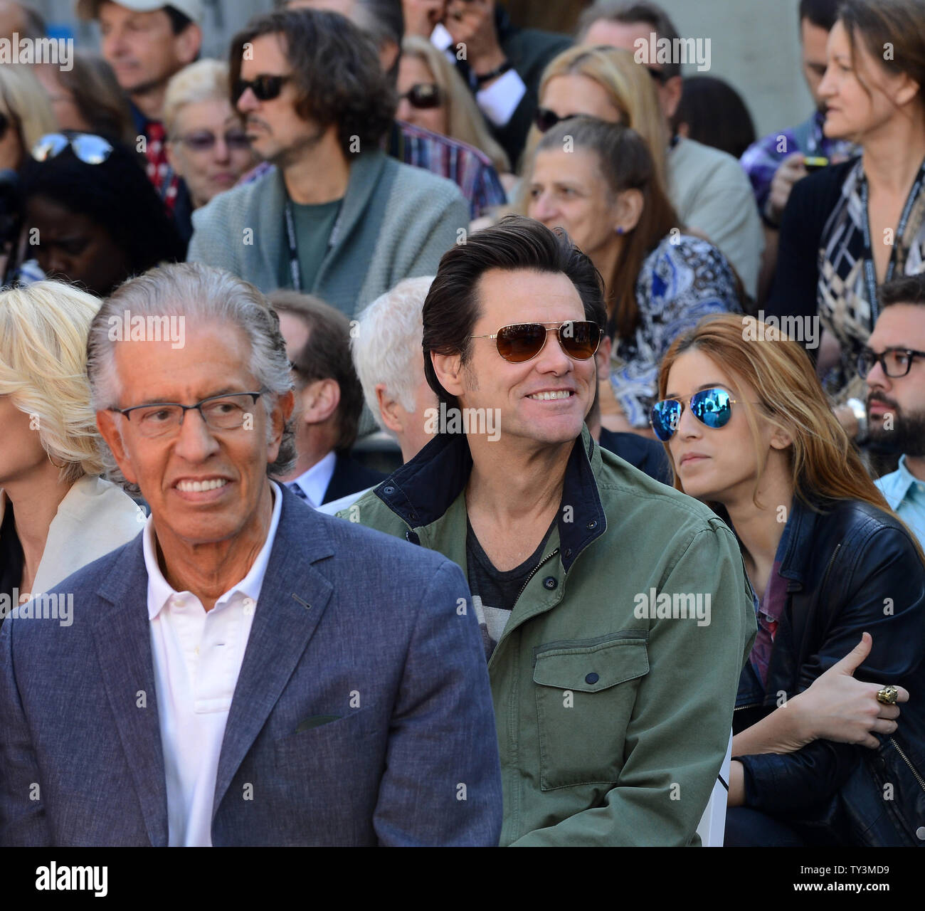 Actor Jim Carrey (R) attends a hand & footprint ceremony honoring actress Jane Fonda as part of the TCM Classic Film Festival, at TCL Chinese Theatre in the Hollywood section of Los Angeles on April 27, 2013. At left is Fonda's boyfriend, record producer Richard Perry. UPI/Jim Ruymen Stock Photo