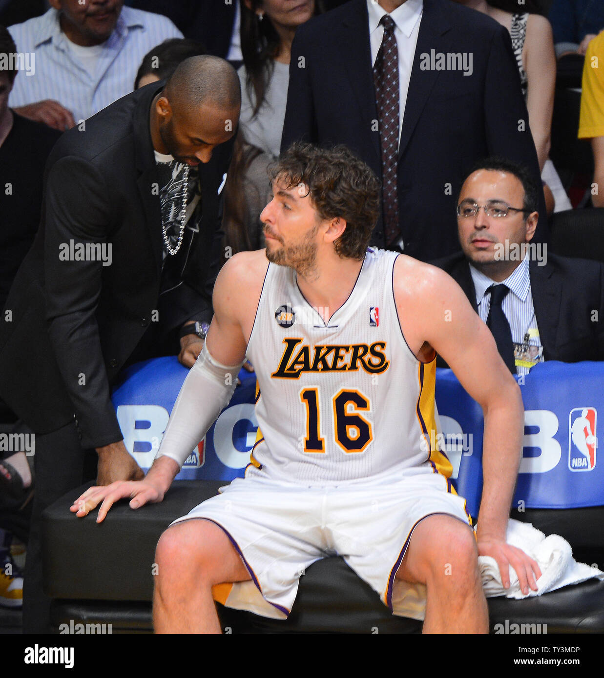 Los Angeles Lakers' Kobe Bryant gives a hug to teammate Pau Gasol after he  came out of the game during the fourth quarter of Game 4 against the San  Antonio Spurs in