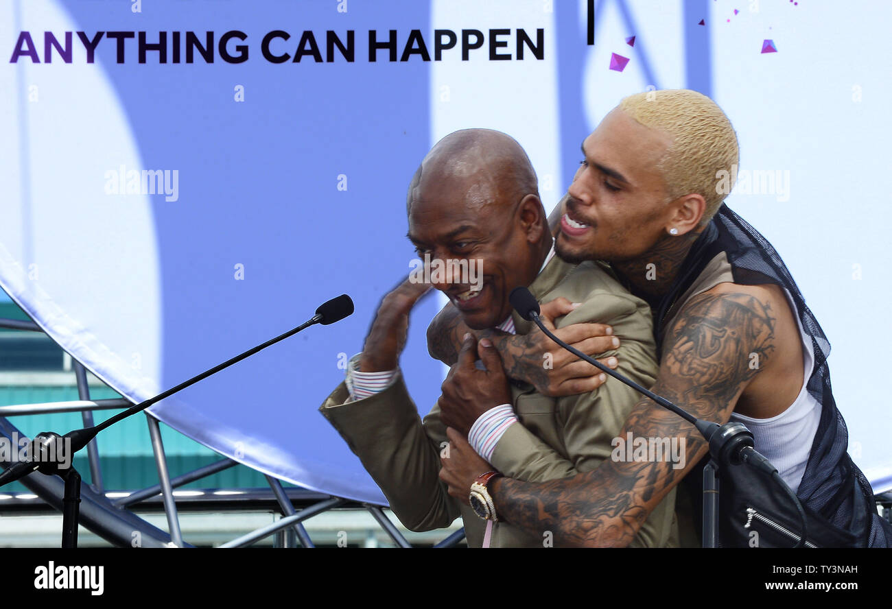 Recording artist Chris Brown embraces Stephen G. Hill, BET's President of Music Programming and Specials, following a BET Awards news conference at Icon Ultra Lounge in Los Angeles on May 14, 2013.  UPI/Jim Ruymen Stock Photo