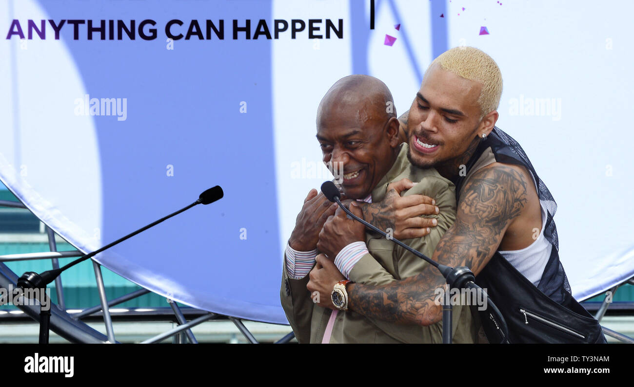 Recording artist Chris Brown embraces Stephen G. Hill, BET's President of Music Programming and Specials, following a BET Awards news conference at Icon Ultra Lounge in Los Angeles on May 14, 2013.  UPI/Jim Ruymen Stock Photo