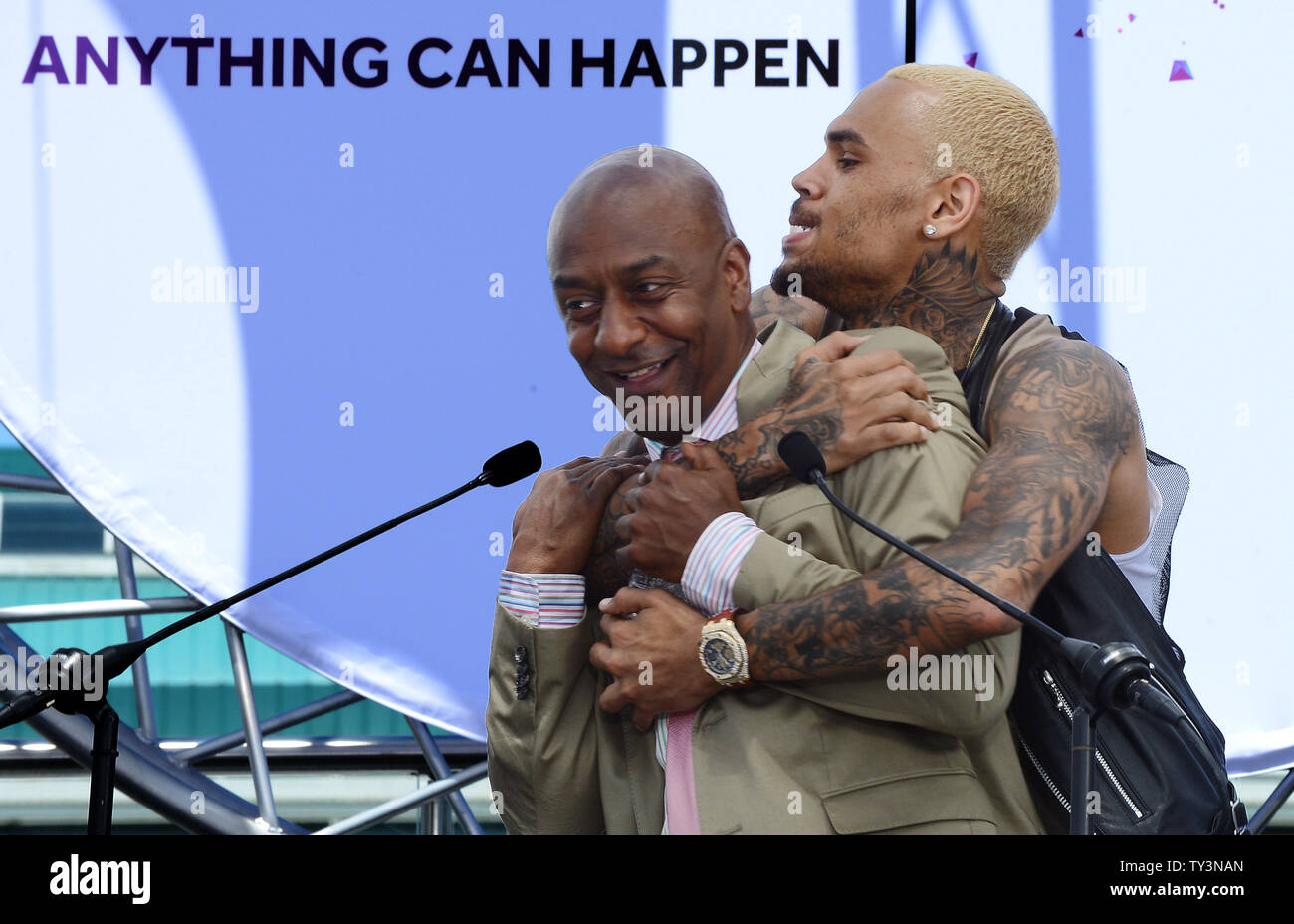 Recording artist Chris Brown embraces Stephen G. Hill, BET's President of Music Programming and Specials, following a BET Awards news conference at Icon Ultra Lounge in Los Angeles on May 14, 2013.  UPI/Jim Ruymen Stock Photo