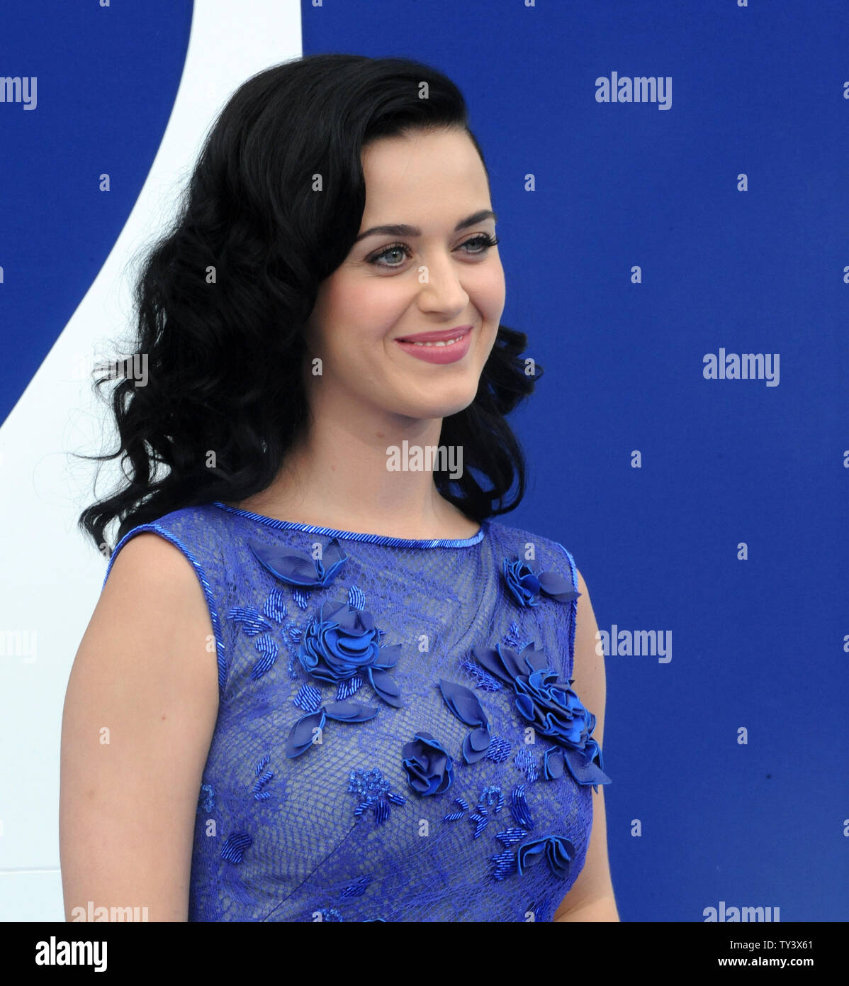Singer and actress Katy Perry, the voice of Smurfette in the motion picture animated comedy 'The Smurfs 2', attends the premiere of the film at the Regency Village Theatre, in the Westwood section of Los Angeles on July 28, 2013. The Smurfs join forces with their human friends to rescue Smurfette, who has been kidnapped by Gargamel since she knows a secret spell that can turn the evil sorcerer's newest creation - creatures called the Naughties - into real Smurfs.  UPI/Jim Ruymen Stock Photo