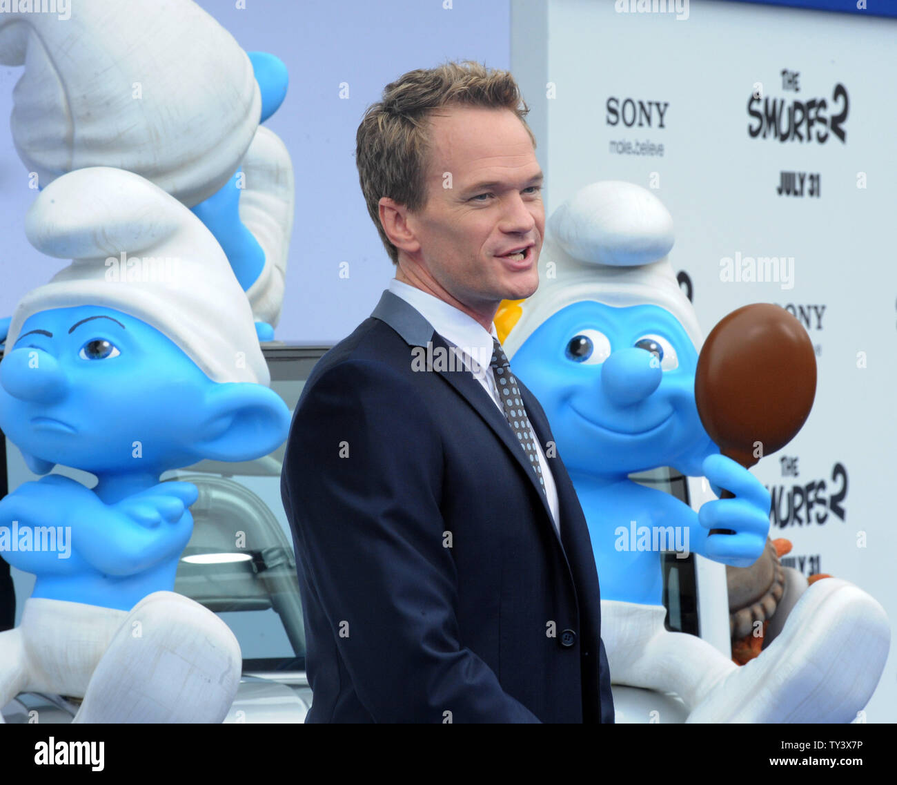 Actor Neil Patrick Harris, the voice of Patrick in the motion picture animated comedy 'The Smurfs 2', attends the premiere of the film at the Regency Village Theatre, in the Westwood section of Los Angeles on July 28, 2013. The Smurfs join forces with their human friends to rescue Smurfette, who has been kidnapped by Gargamel since she knows a secret spell that can turn the evil sorcerer's newest creation - creatures called the Naughties - into real Smurfs.  UPI/Jim Ruymen Stock Photo