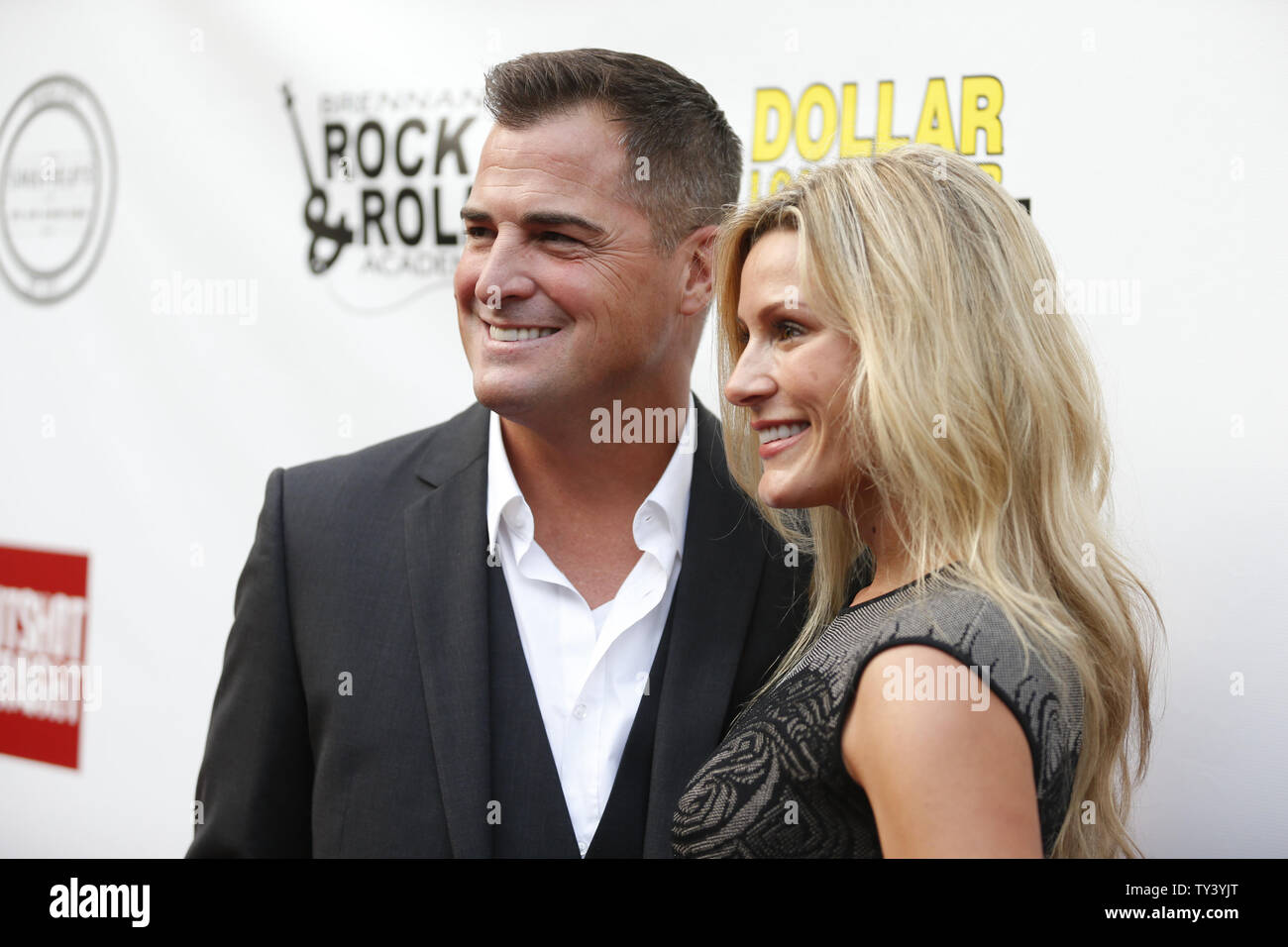 Cast member George Eads and wife Monika Casey attend the premiere of the motion picture thriller 'Gutshot Straight', at the Zanuck Theatre at Fox Studios in Los Angeles on August 12, 2013.  The crime story follows Eads’s Jack, a poker player who takes on Lang and Levine brothers in the Vegas underworld, with AnnaLynne McCord playing a femme fatale involved in the treachery.    UPI/Danny Moloshok Stock Photo