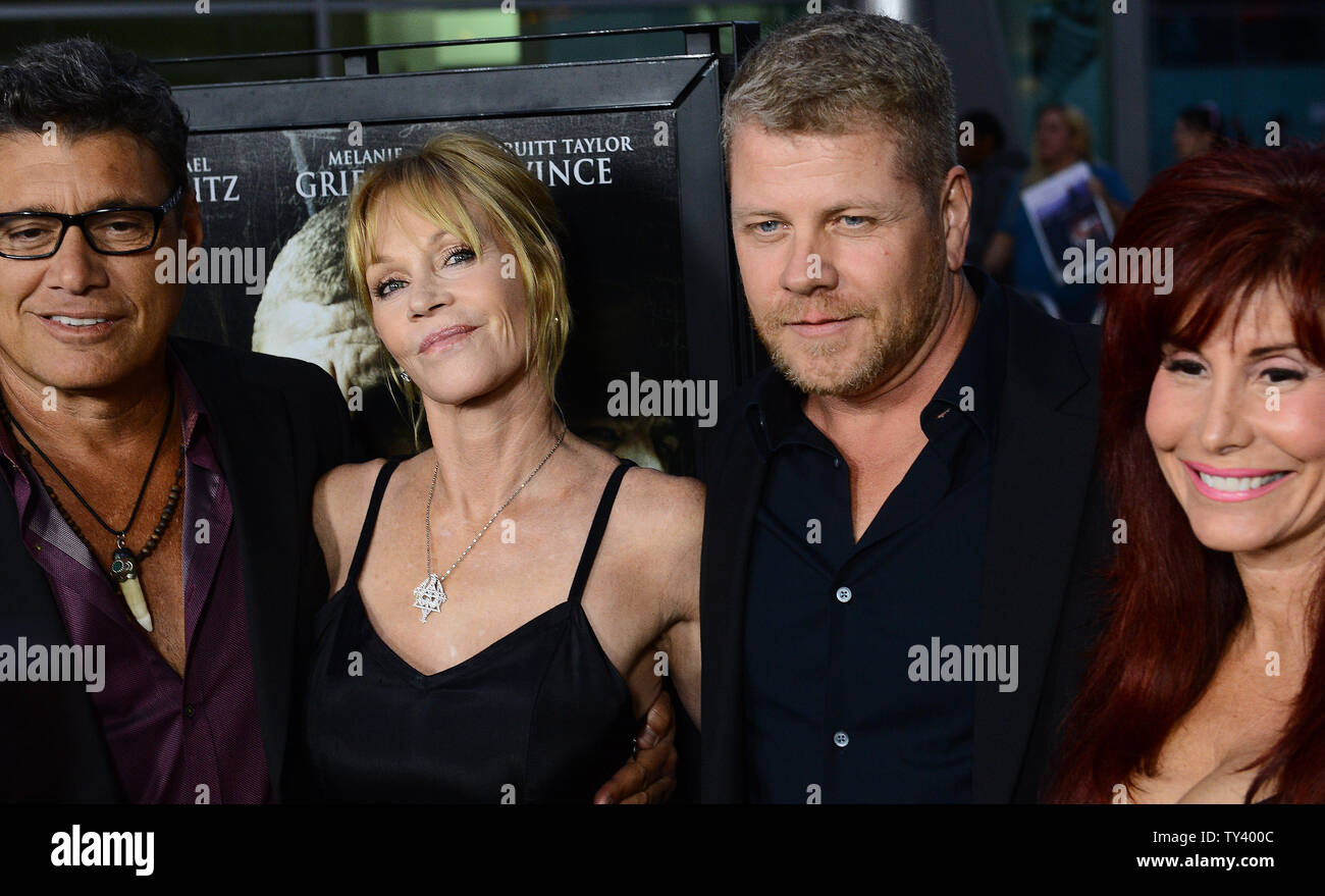 Cast member Melanie Griffith and co-star Michael Cudlitz along with producer Suzanne DeLaurentiis (R) attend the premiere of the motion picture thriller 'Dark Tourist' at the Arclight Cinerama Dome in the Hollywood section of Los Angeles on August 14, 2013. The psychological-thriller takes us into the chilling labyrinth of a man's dark hobby - the act of traveling with the intent to visit places of tragedy or disaster and his even darker mind.  UPI/Jim Ruymen Stock Photo