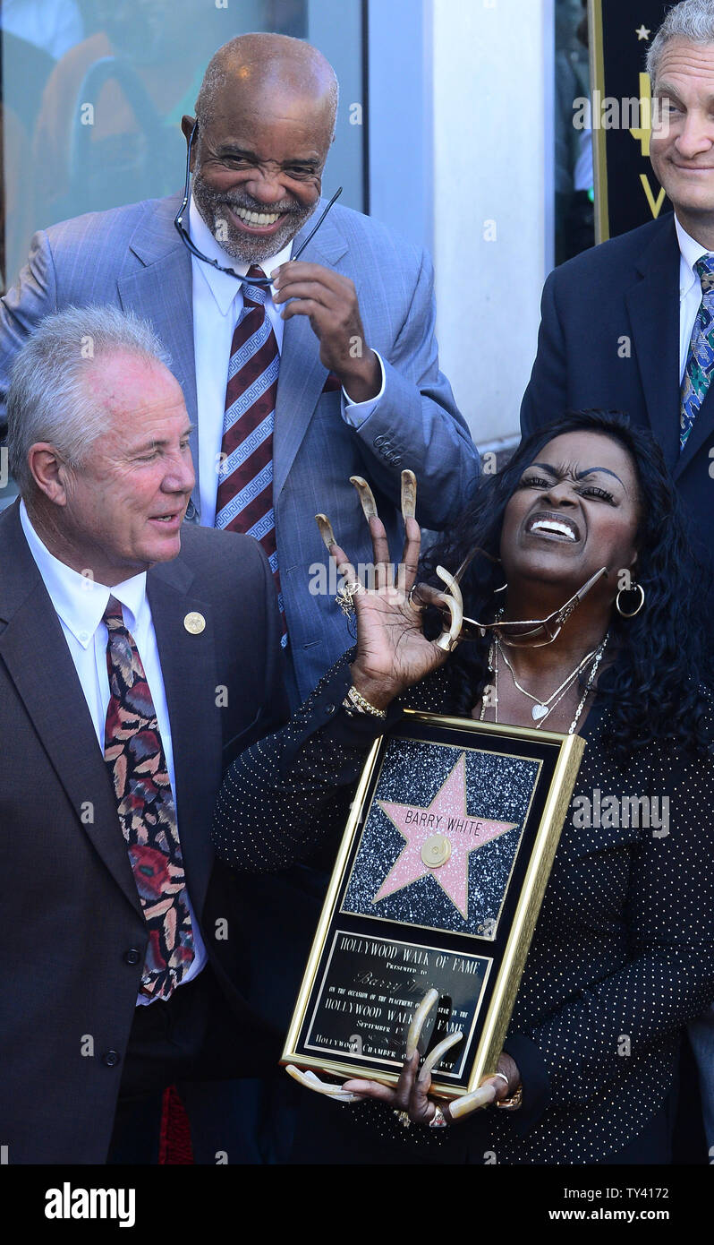 Glodean White The Wife Of Singer Barry White Holds A Replica Plaque As Glodean White The Wife Of Singer Barry White Holds A Replica Plaque As She Shares A Laugh With Motown Founder Berry Gordy 2nd L During An Unveiling Ceremony Honoring White Posthumously With The 2506th Star On The Hollywood Walk Of Fame In Los Angeles On September 12 2013 Barry White Known For His Rich Bass Voice And Romantic Image Would Have Been 69 Today Upijim Ruymen TY4172