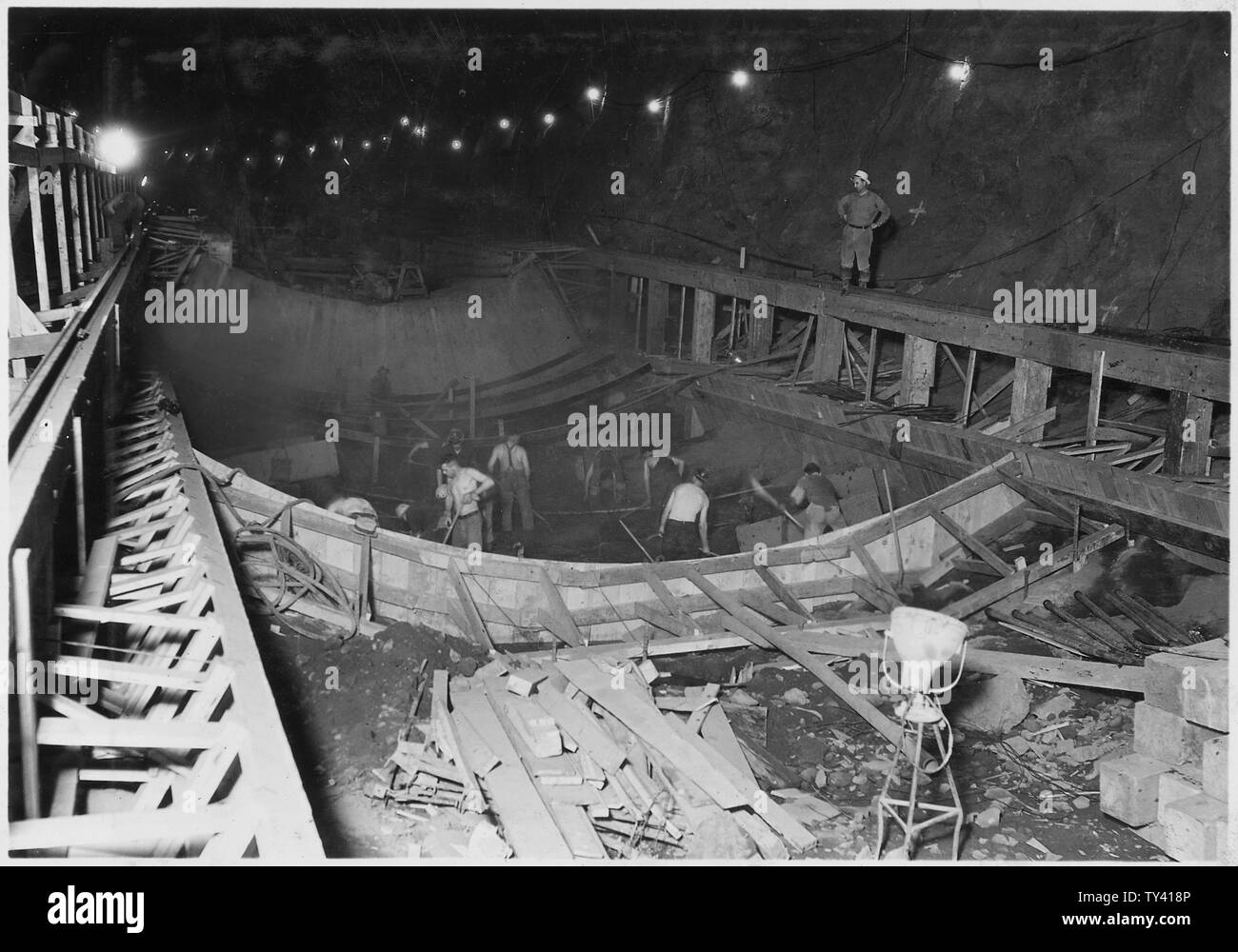 Excavation and forms for tunnel plug lining in diversion tunnel No. 4. The concrete face of the
