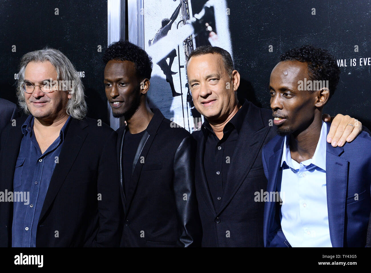 Cast member Tom Hanks with cast members attends the premiere of the  biographical motion picture thriller "Captain Phillips" at the Academy of  Motion Picture Arts & Sciences in Beverly Hills, California on