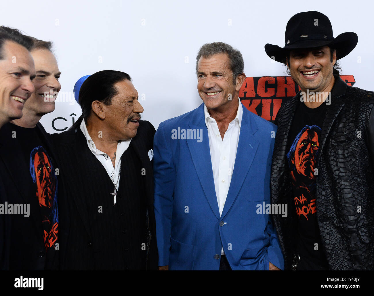 Cast members Danny Trejo, Mel Gibson, and director Robert Rodriguez attend  the premiere of the motion picture crime thriller "Machete Kills" at  Regency Cinemas LA Live in Los Angeles on October 2,