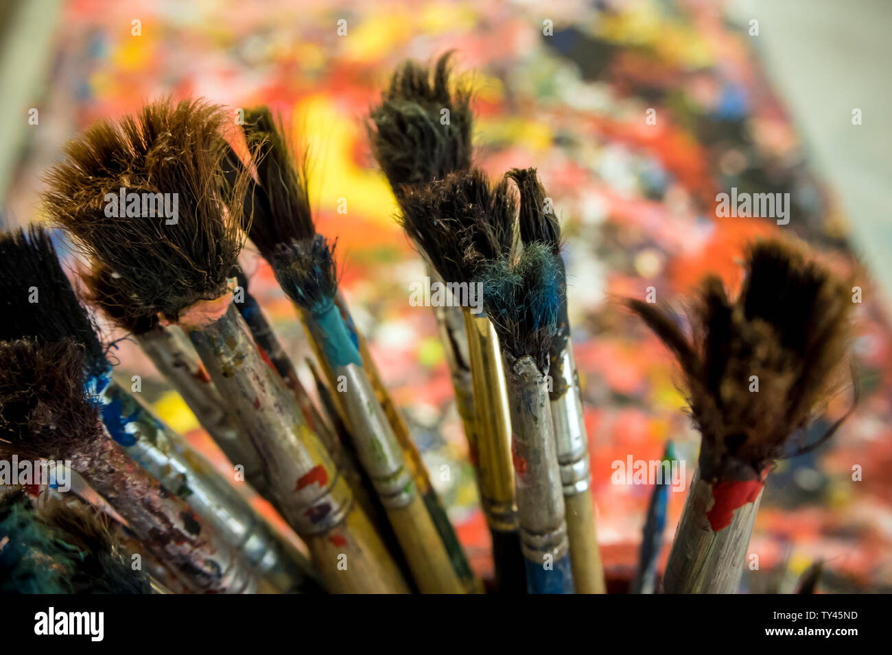 Many old paintbrushes on artwork table Stock Photo Alamy