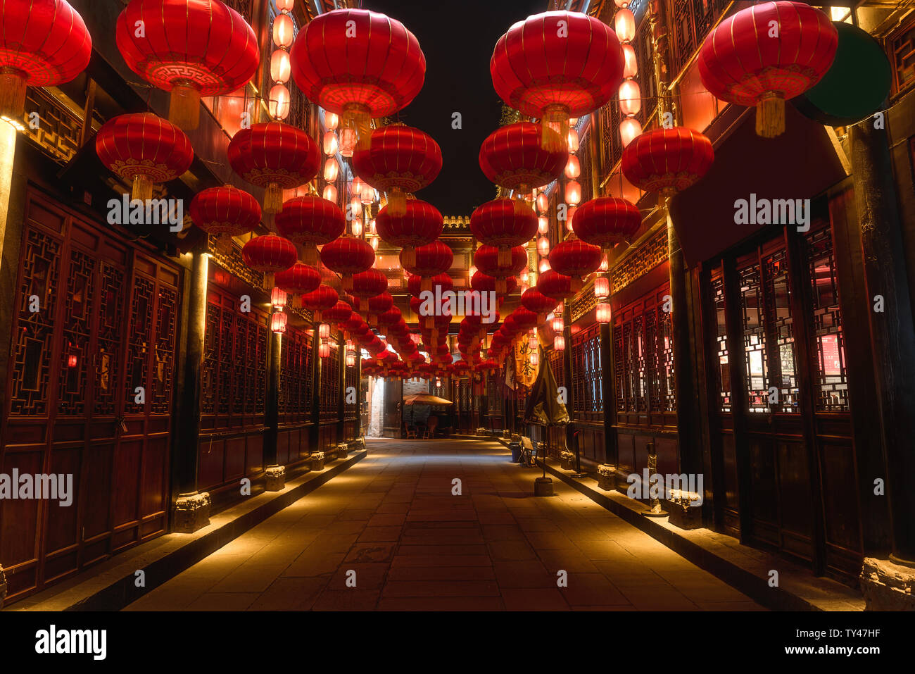 The traditional red Chinese lanterns in JInli,Chengdu,China during Chinese Lunar New Year.The Chinese characters on the inscription mean'snacks' and t Stock Photo