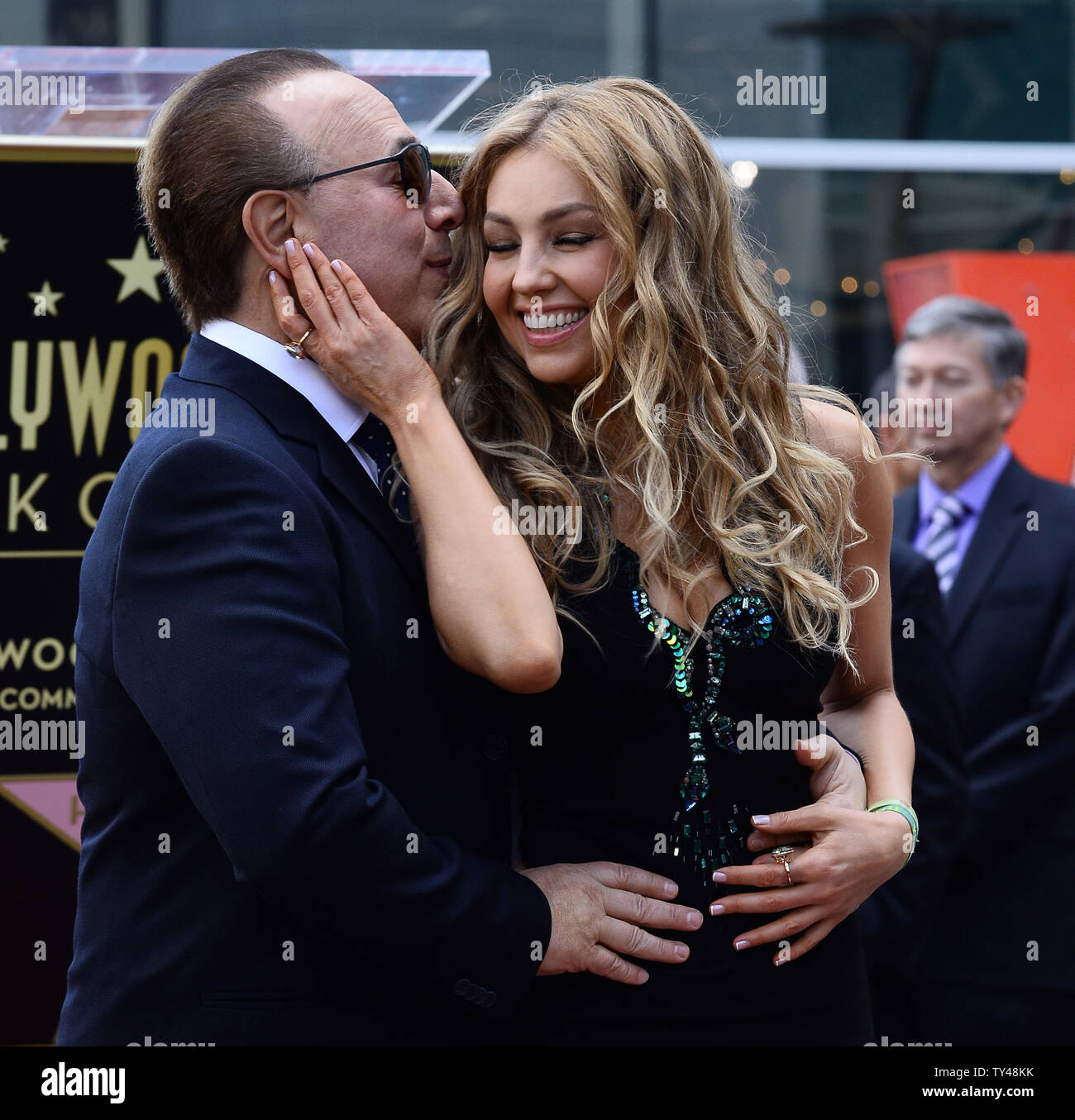 Mexican singer and television star Thalia poses with her husband Tommy
