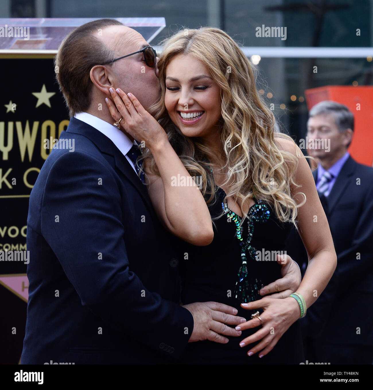 Mexican singer and television star Thalia poses with her husband Tommy
