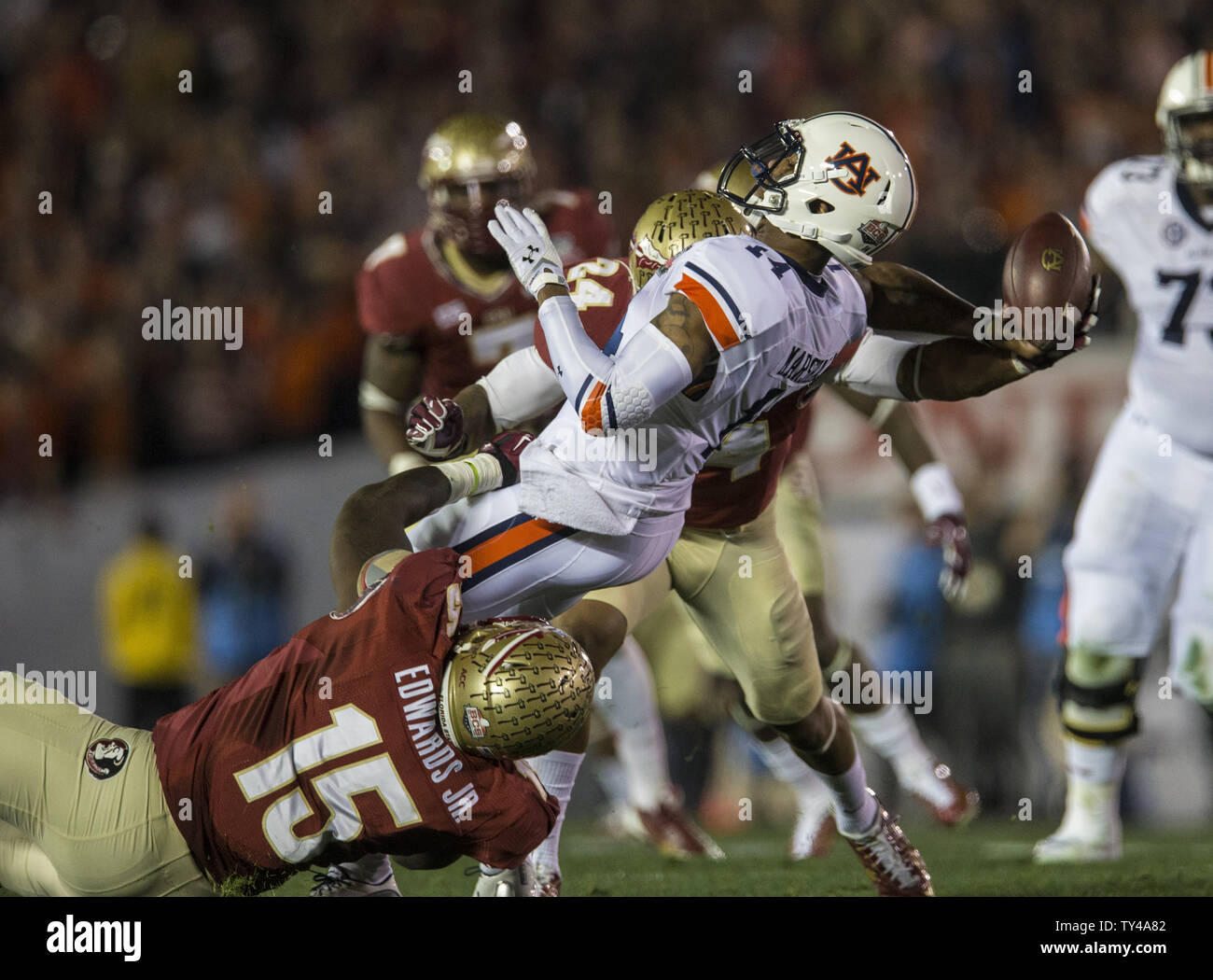 Auburn quarterback Nick Marshall draws a flag for intentional grounding as  FSU defensive players Mario Edwards Jr (15) and Terrance Smith bring him  down in the first half the BCS national title