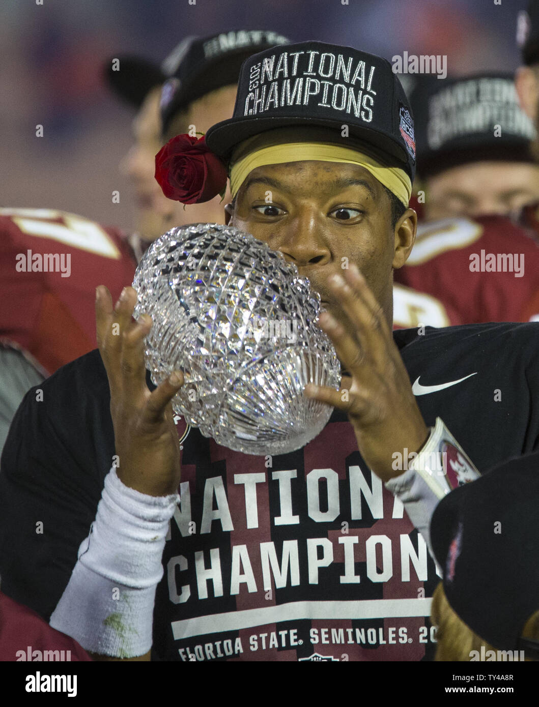 FSU freshman Heisman quarterback Jameis Winston looks at the crystal football after winning the national championship on his birthday and the offensive MVP at the BCS national title game at the Rose Bowl in Pasadena, California on January 6, 2014.  Florida State Seminoles defeated the Auburn Tigers 34-31 for the title.  UPI/Mark Wallheiser Stock Photo
