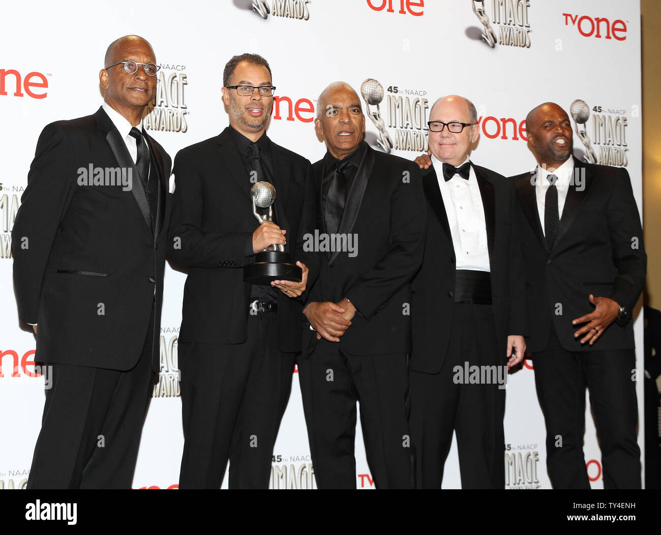 Producers of Real Husbands of Hollywood Ralph Farquhar, Jesse Collins, Stan Lathan, Tim Gibbons, and Chris Spencer hold the award they won for Outstanding Comedy Series for 'Real Husbands of Hollywood' backstage at the 45th NAACP Image Awards at the Pasadena Civic Auditorium in Pasadena, California on February 22, 2014. The NAACP Image Awards celebrates the accomplishments of people of color in the fields of television, music, literature and film and also honors individuals or groups who promote social justice through creative endeavors.   UPI/Ken Matsui Stock Photo