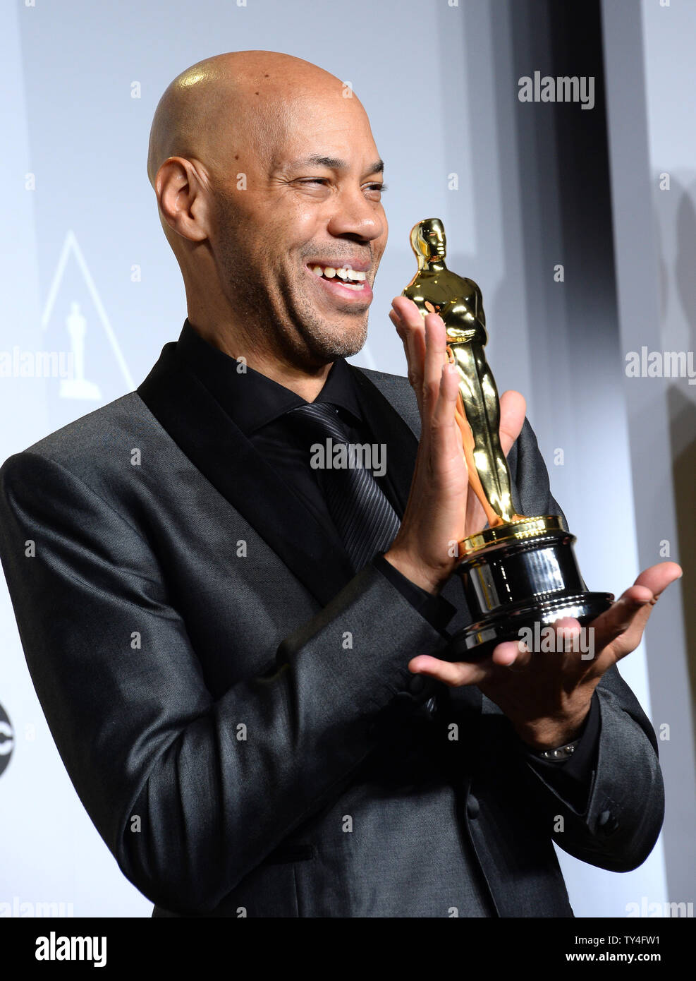 John Ridley Writer John Ridley holds the awrd he won for Best Writing, Screenplay ...