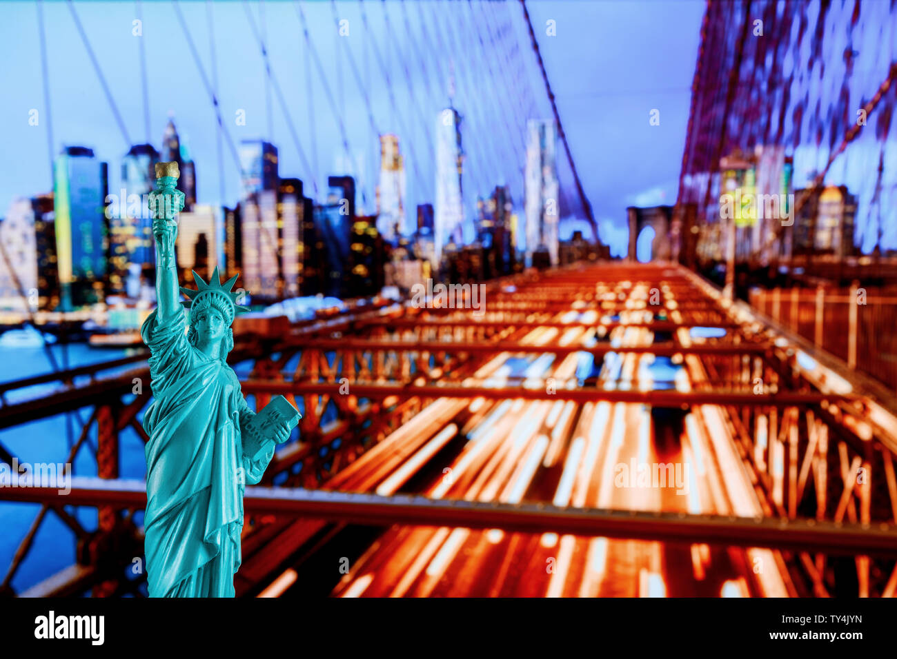 Manhattan Skyline, Brooklyn Bridge and The Statue of Liberty at New York City Stock Photo