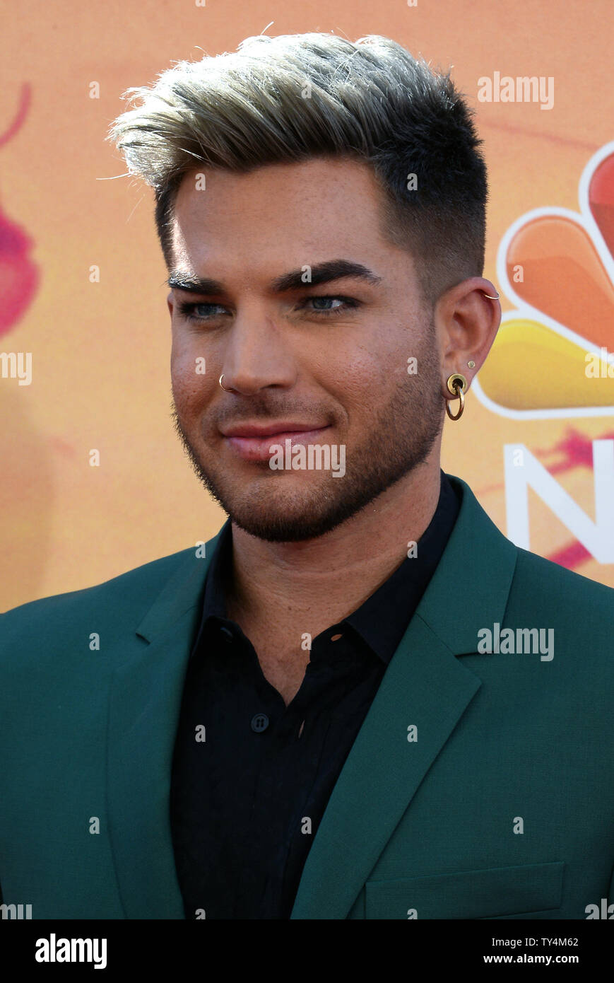 Stage actor and singer-songwriter Adam Lambert attends the I Heart ...