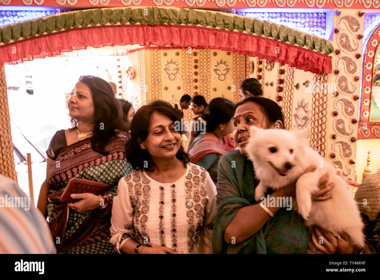 Female,visitors,devotees,worshippers,to Durga Puja panda,a pet dog,as well,, South Kolkata,India. Stock Photo