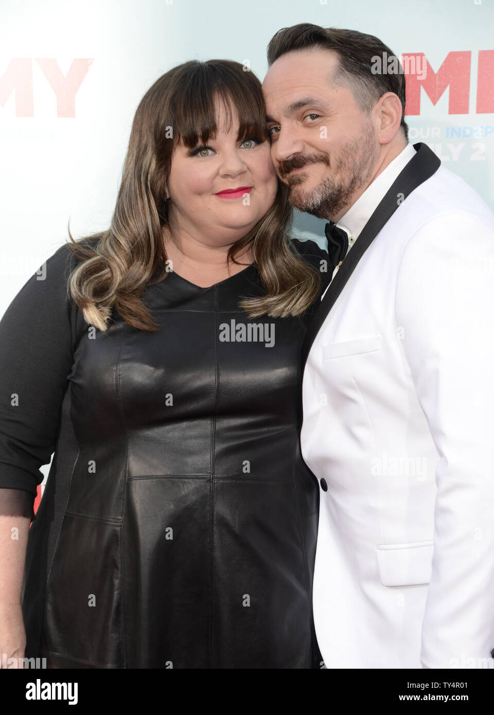 Director Ben Falcone (R) and cast member Melissa McCarthy (L) attend the premiere of 'Tammy' in Los Angeles  on June 30, 2014.      UPI/Phil McCarten Stock Photo