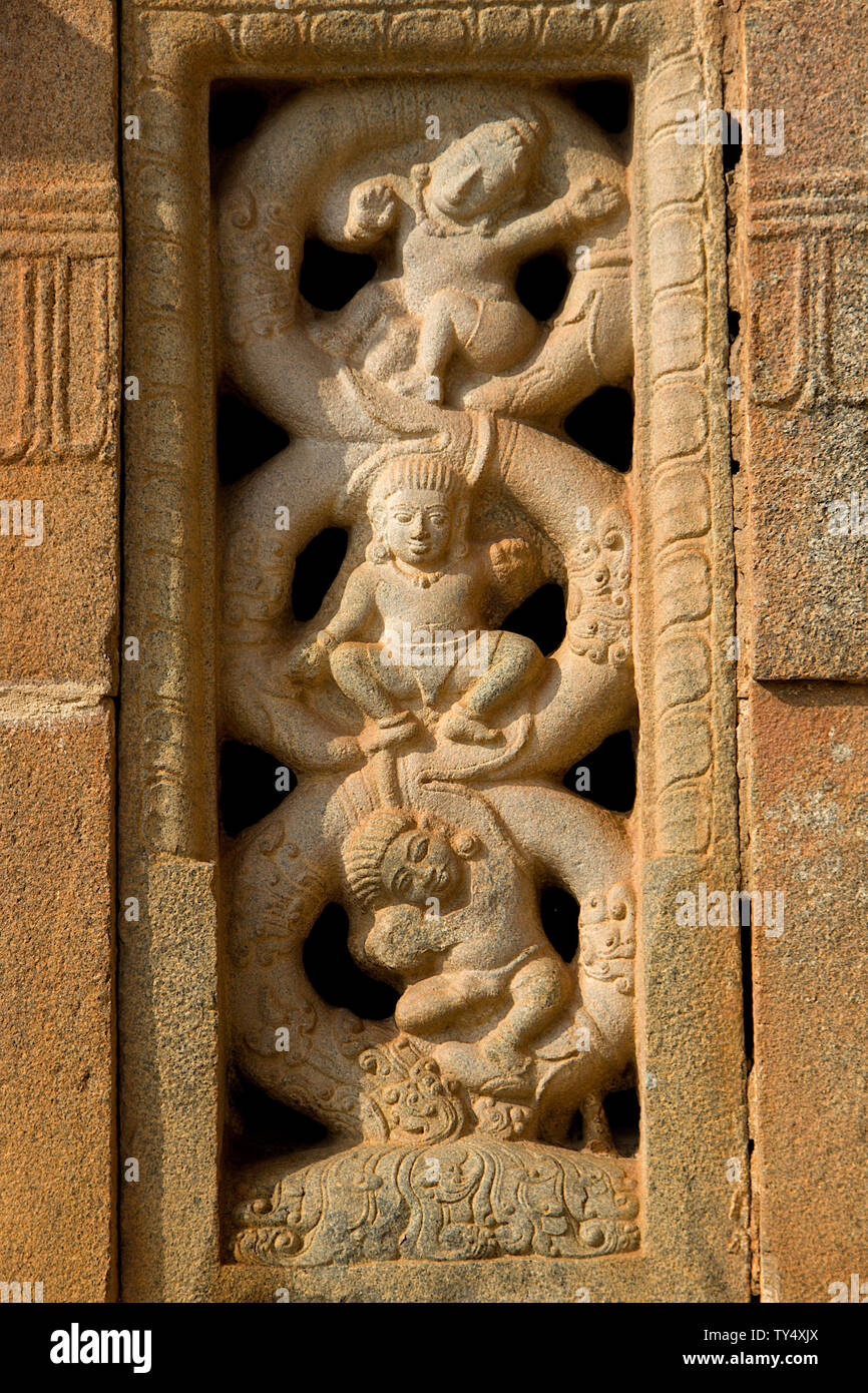 Interesting carving on vertical stone window frame at Nandish Temple in Nandi Hills near Bengaluru, Karnataka, India, Asia Stock Photo
