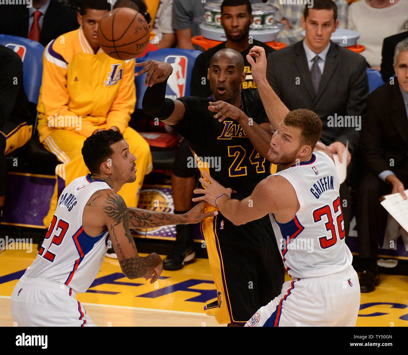 Los Angeles Lakers Guard Kobe Bryant Passes The Ball Between Los