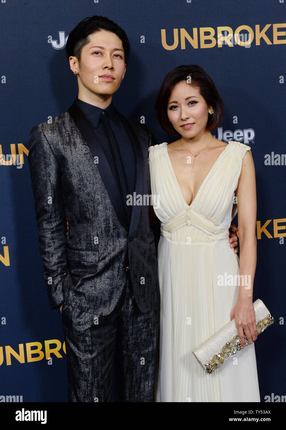 Cast member Takamasa Ishihara aka 'Miyavi' and his wife, pop singer Miyuki Ishihara attend the premiere of the biographical motion picture war drama "Unbroken" at the Dolby Theatre in the Hollywood section of Los Angeles on December 15, 2014. Storyline: After a near-fatal plane crash in WWII, Olympian Louis Zamperini spends a harrowing 47 days in a raft with two fellow crewmen before he's caught by the Japanese navy and sent to a prisoner-of-war camp.  UPI/Jim Ruymen Stock Photo
